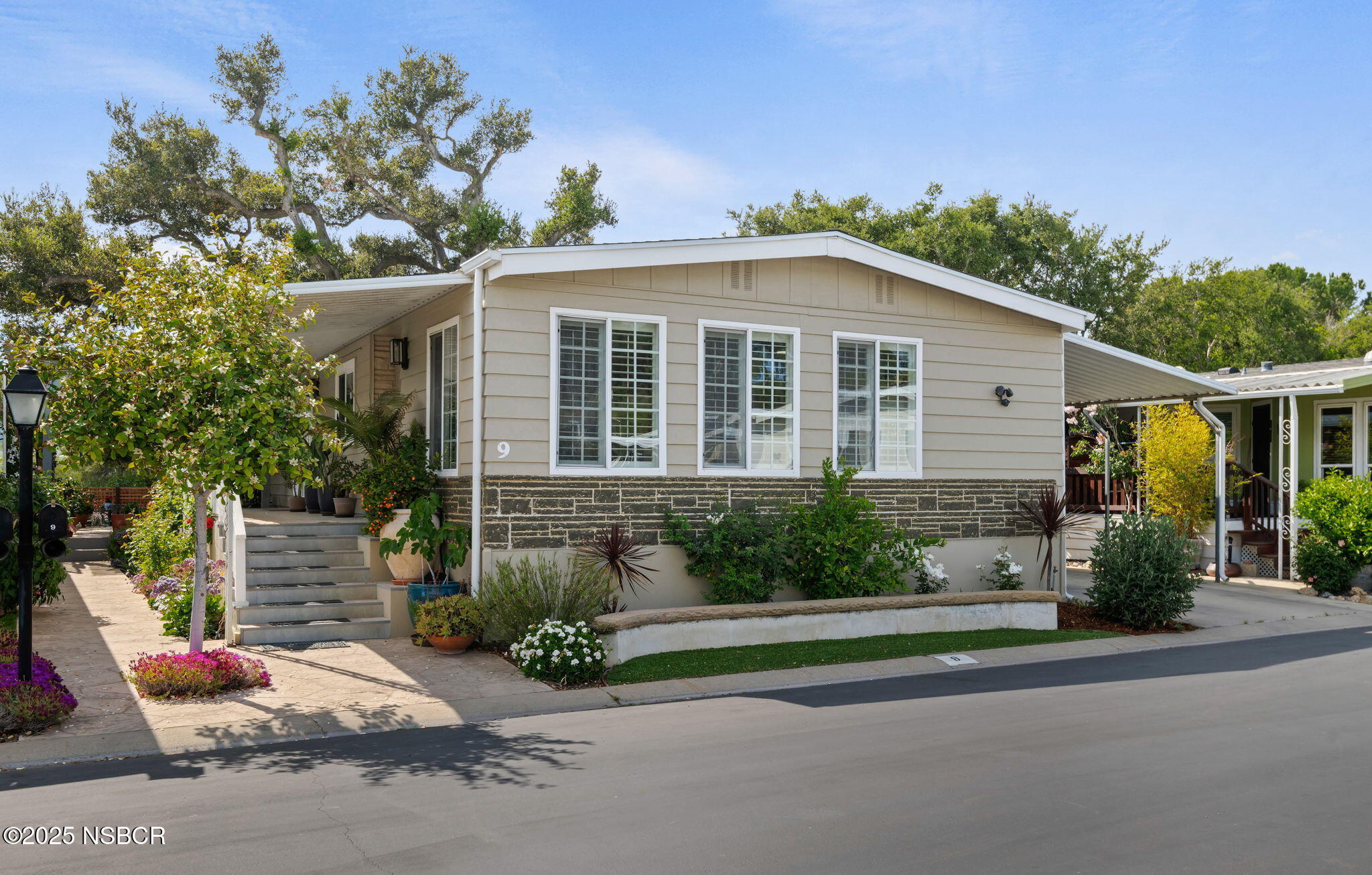 front view of a house with a yard