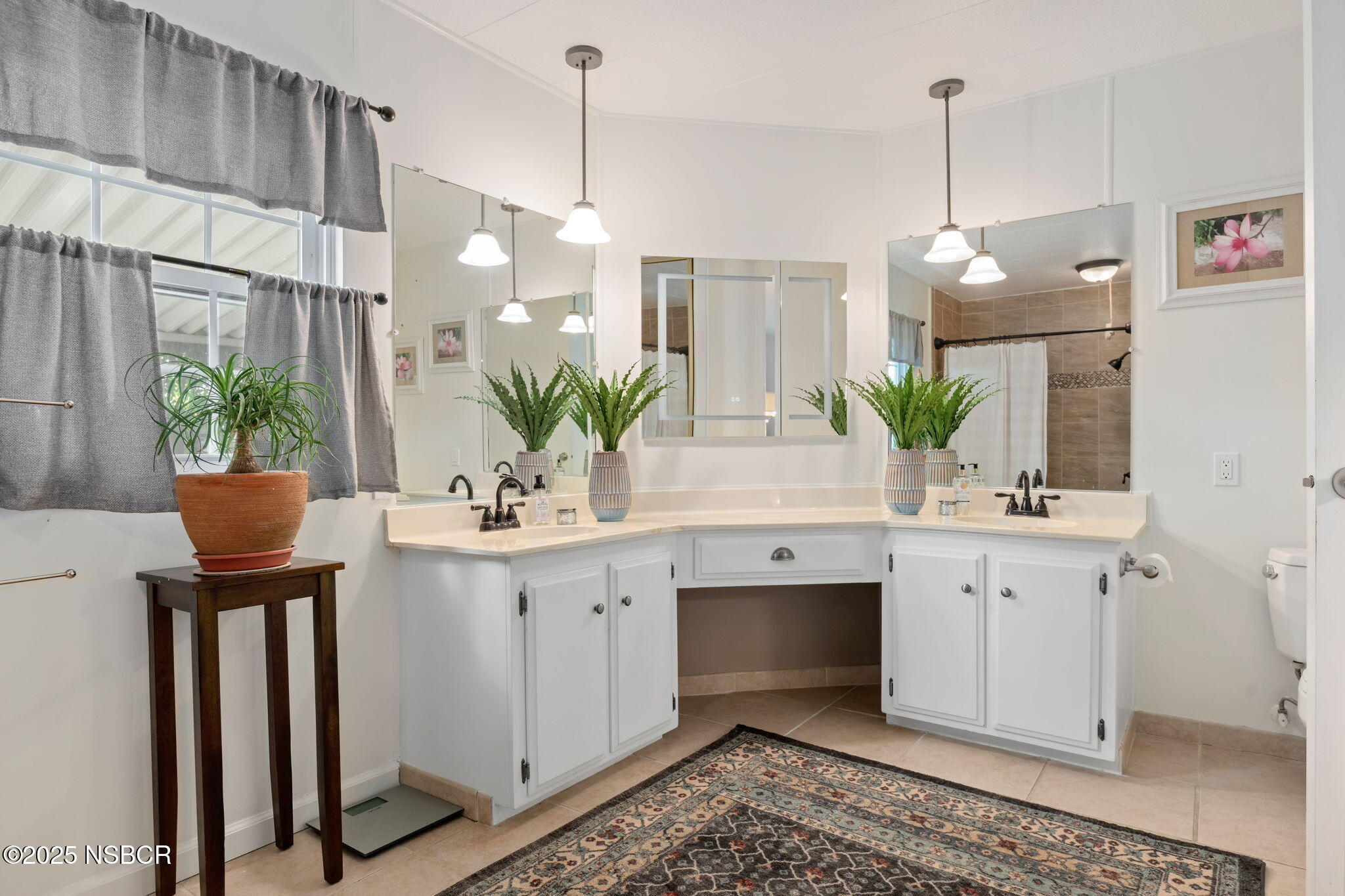 9 Paseo Del Rio Solvang, CA 93463 - Photo 15 of 32 a kitchen with a sink and white cabinets
