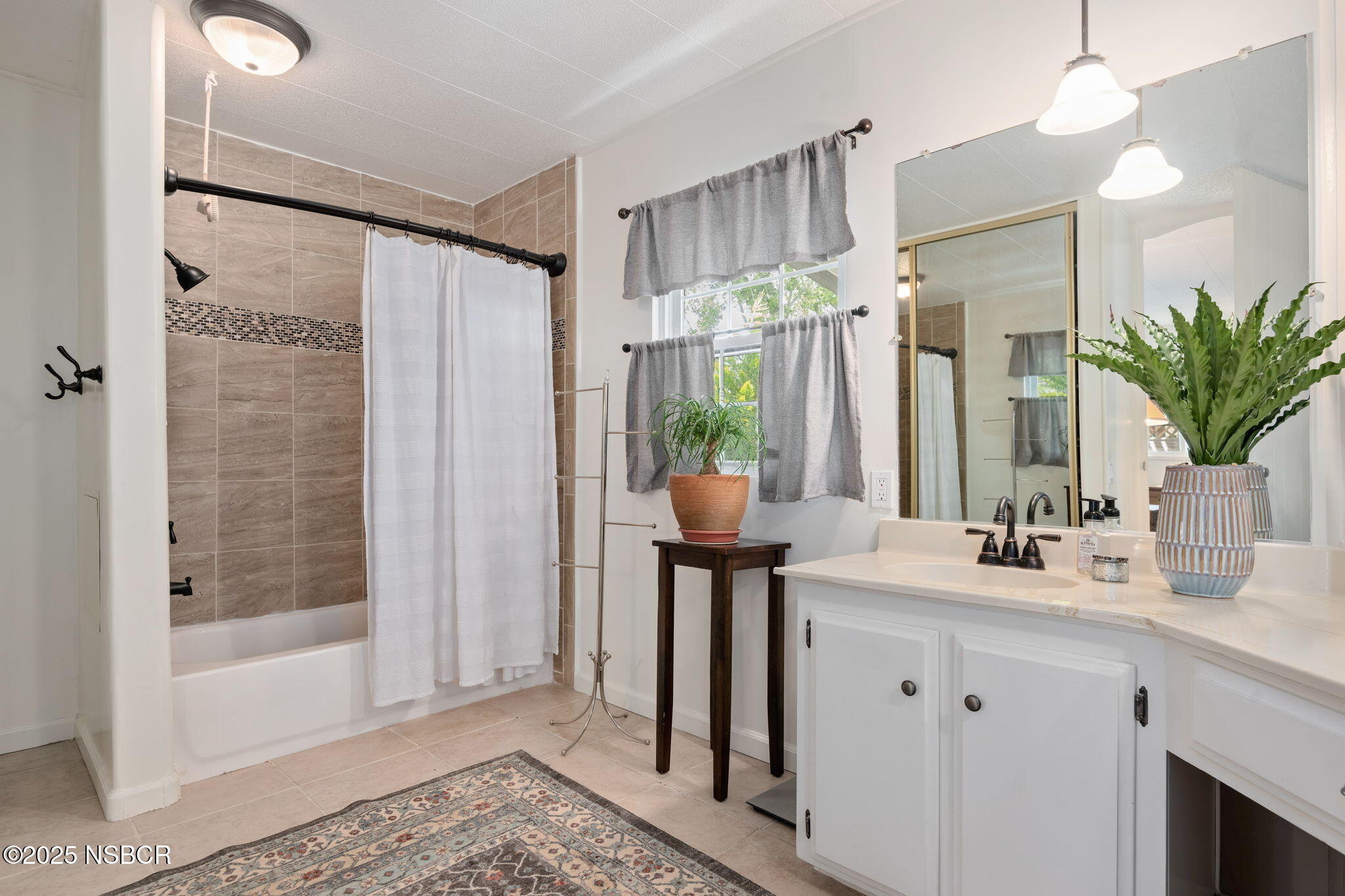 9 Paseo Del Rio Solvang, CA 93463 - Photo 16 of 32 a bathroom with a double vanity sink mirror and shower