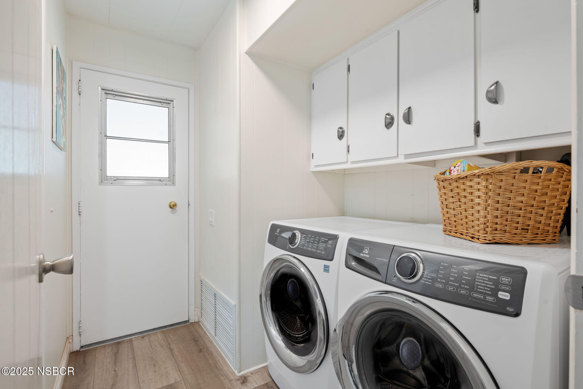 9 Paseo Del Rio Solvang, CA 93463 - Photo 20 of 32 a view of washer and dryer with kitchen in the background