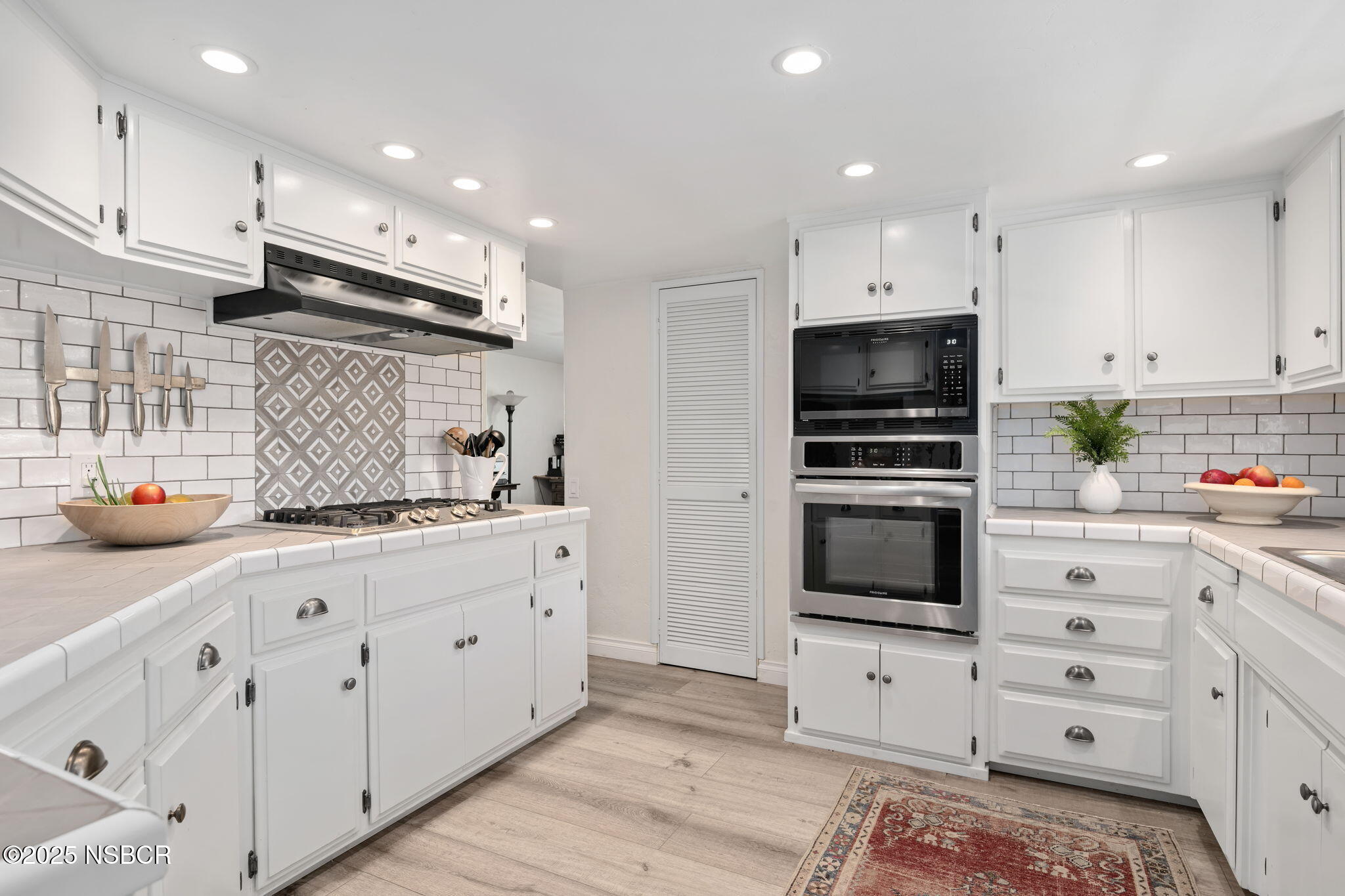 9 Paseo Del Rio Solvang, CA 93463 - Photo 3 of 32 a kitchen with appliances a sink and cabinets