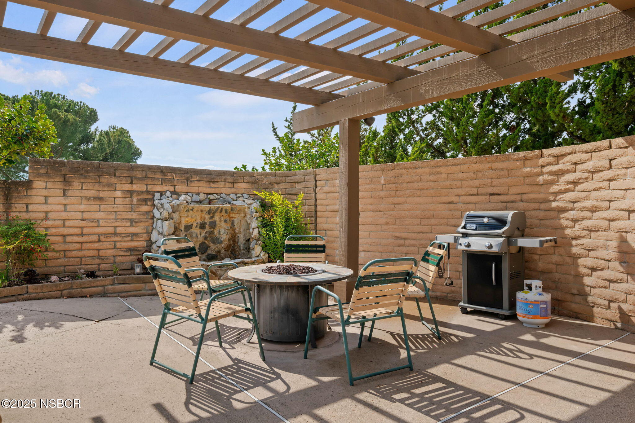 9 Paseo Del Rio Solvang, CA 93463 - Photo 31 of 32 a view of a patio with table and chairs and potted plants