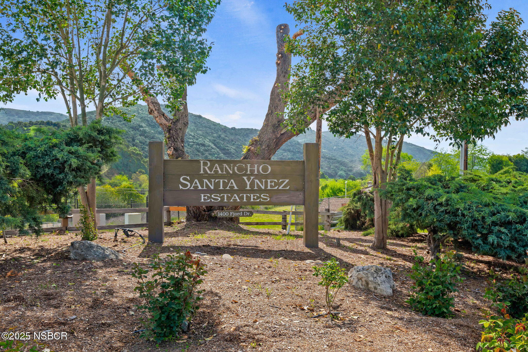 9 Paseo Del Rio Solvang, CA 93463 - Photo 32 of 32 a sign that is sitting in front of a tree