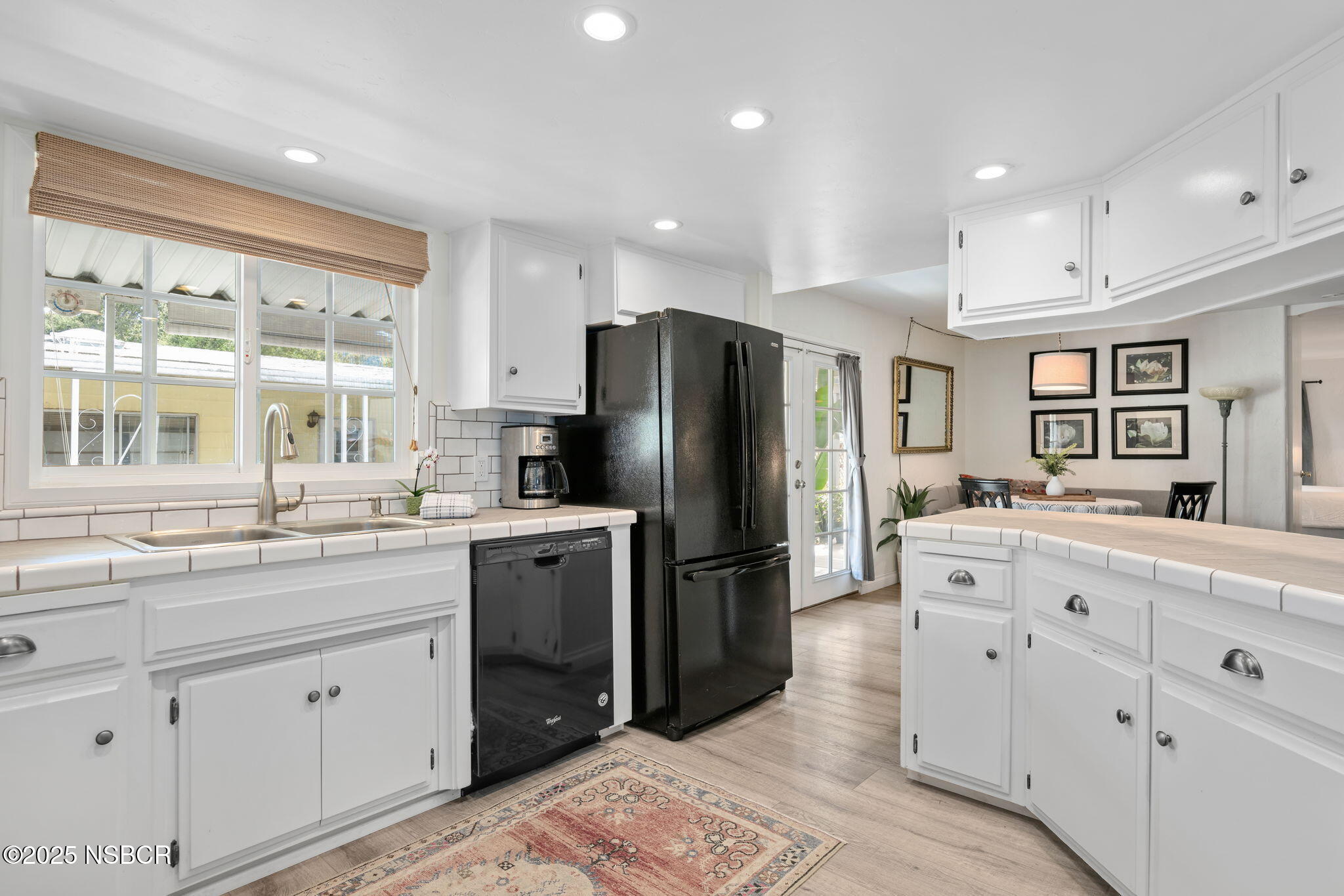 9 Paseo Del Rio Solvang, CA 93463 - Photo 4 of 32 a kitchen with kitchen island granite countertop appliances cabinets and a sink