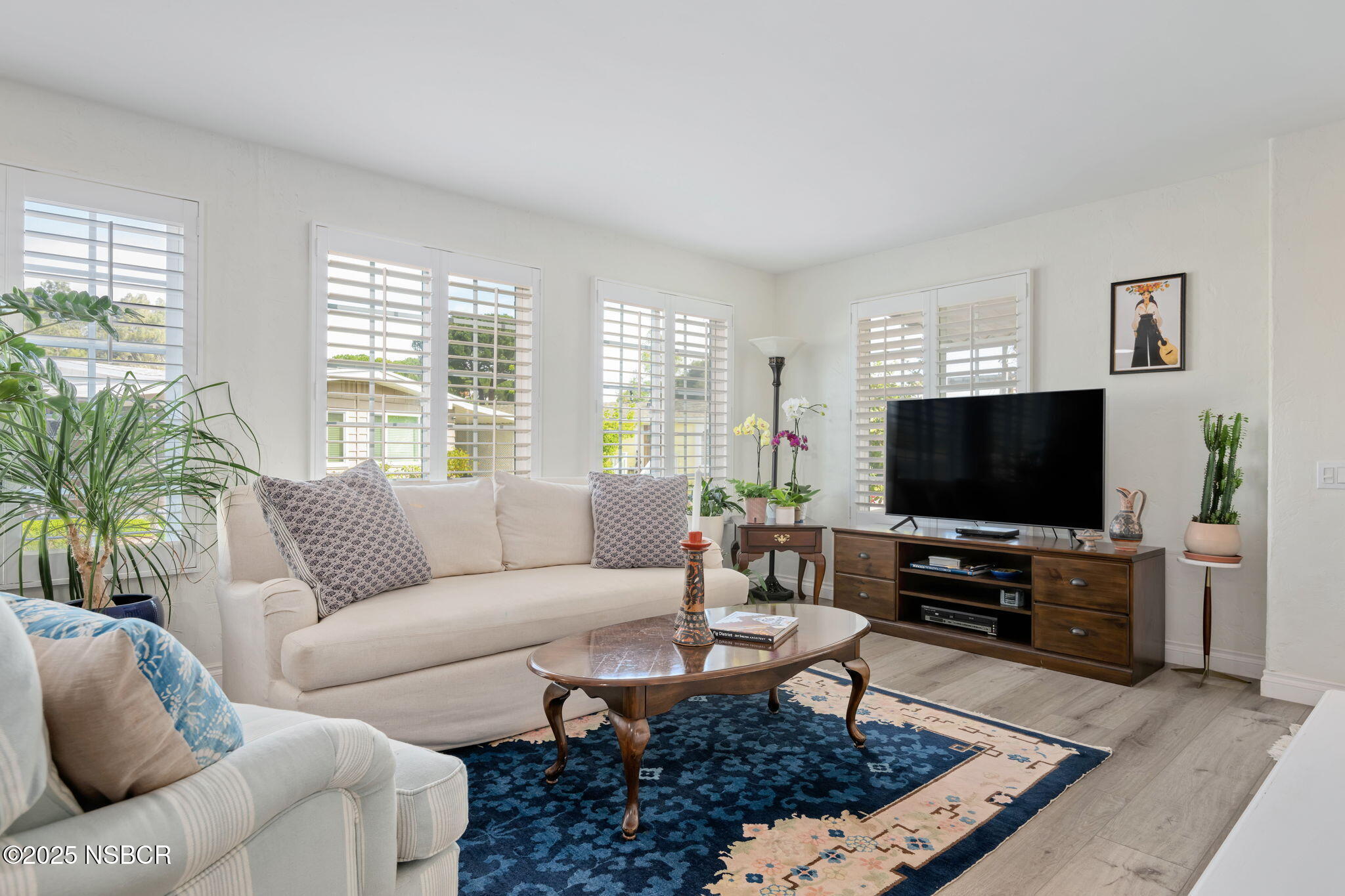 9 Paseo Del Rio Solvang, CA 93463 - Photo 8 of 32 a living room with furniture and a flat screen tv