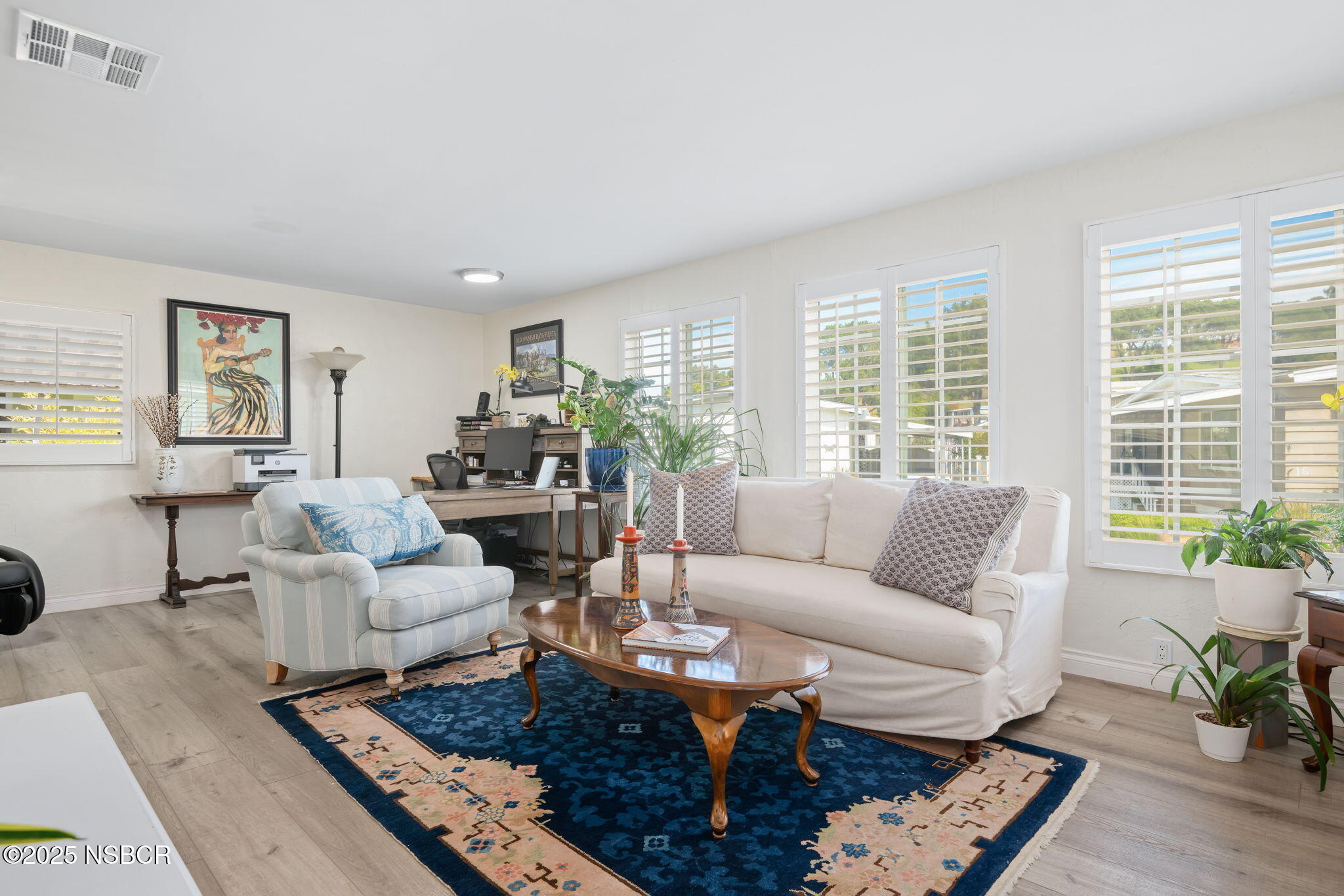 9 Paseo Del Rio Solvang, CA 93463 - Photo 9 of 32 a living room with furniture a rug a lamp and a large window