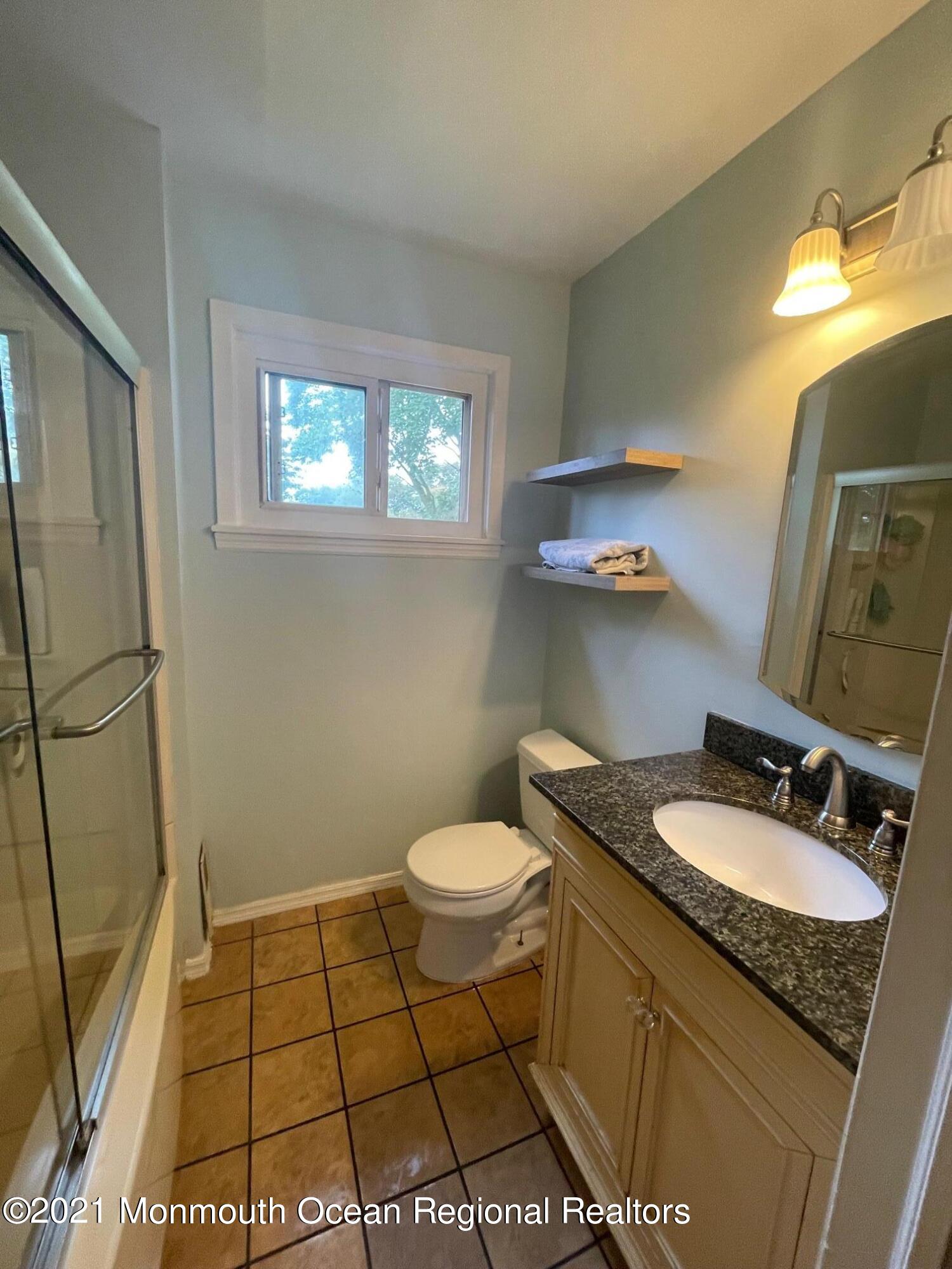 137 Crestview Drive Middletown, NJ 07748 - Photo 15 of 18 a bathroom with a granite countertop sink toilet and a mirror