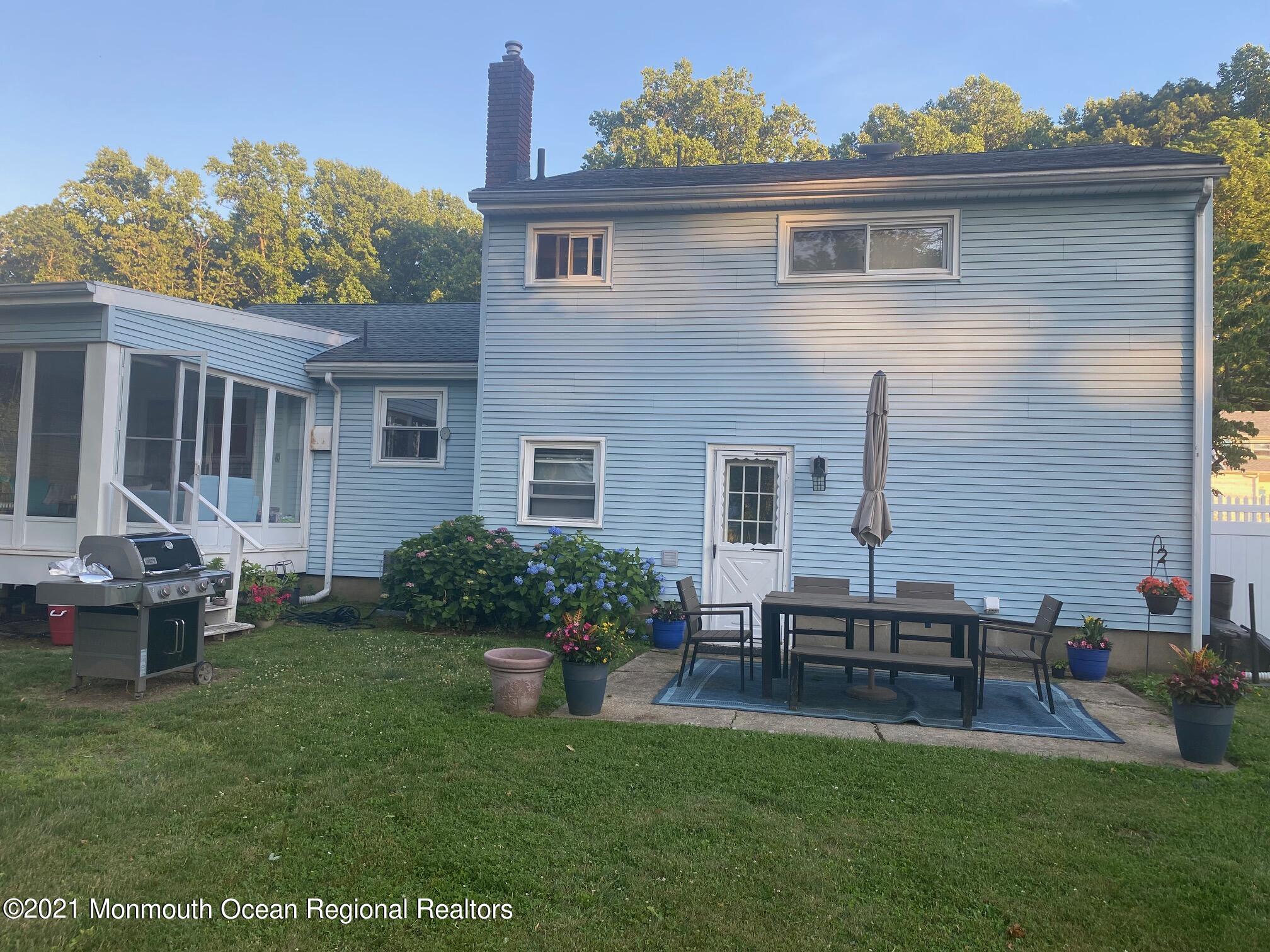 137 Crestview Drive Middletown, NJ 07748 - Photo 17 of 18 a front view of a house with garden