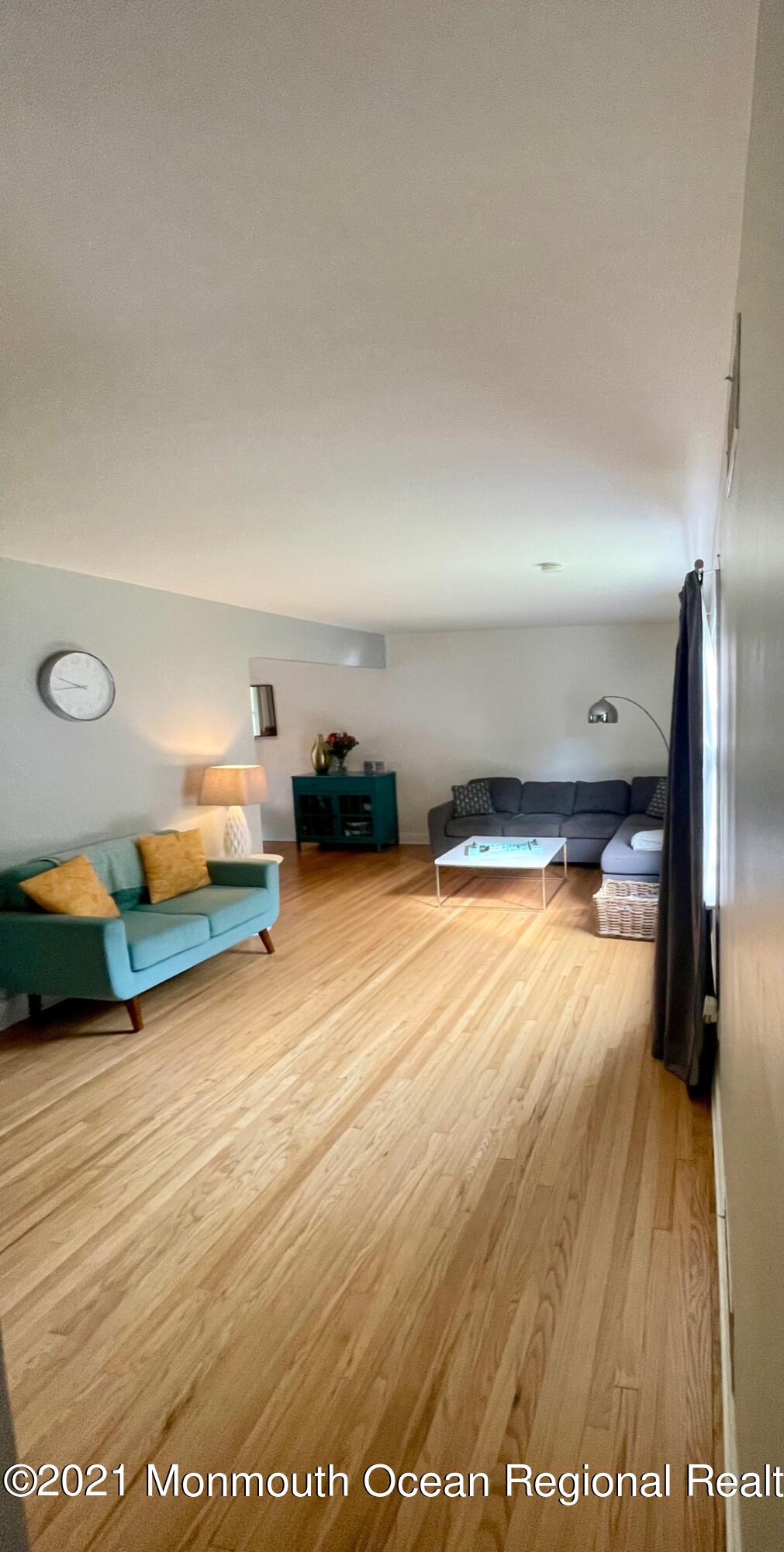 137 Crestview Drive Middletown, NJ 07748 - Photo 3 of 18 a room with gym equipment and wooden floor
