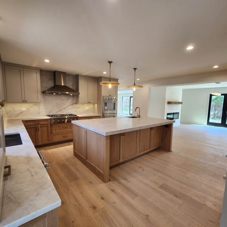 1975 Sunset Ridge Road Northfield, IL 60093 - Photo 11 of 21 a large kitchen with a large counter top a sink stainless steel appliances and cabinets