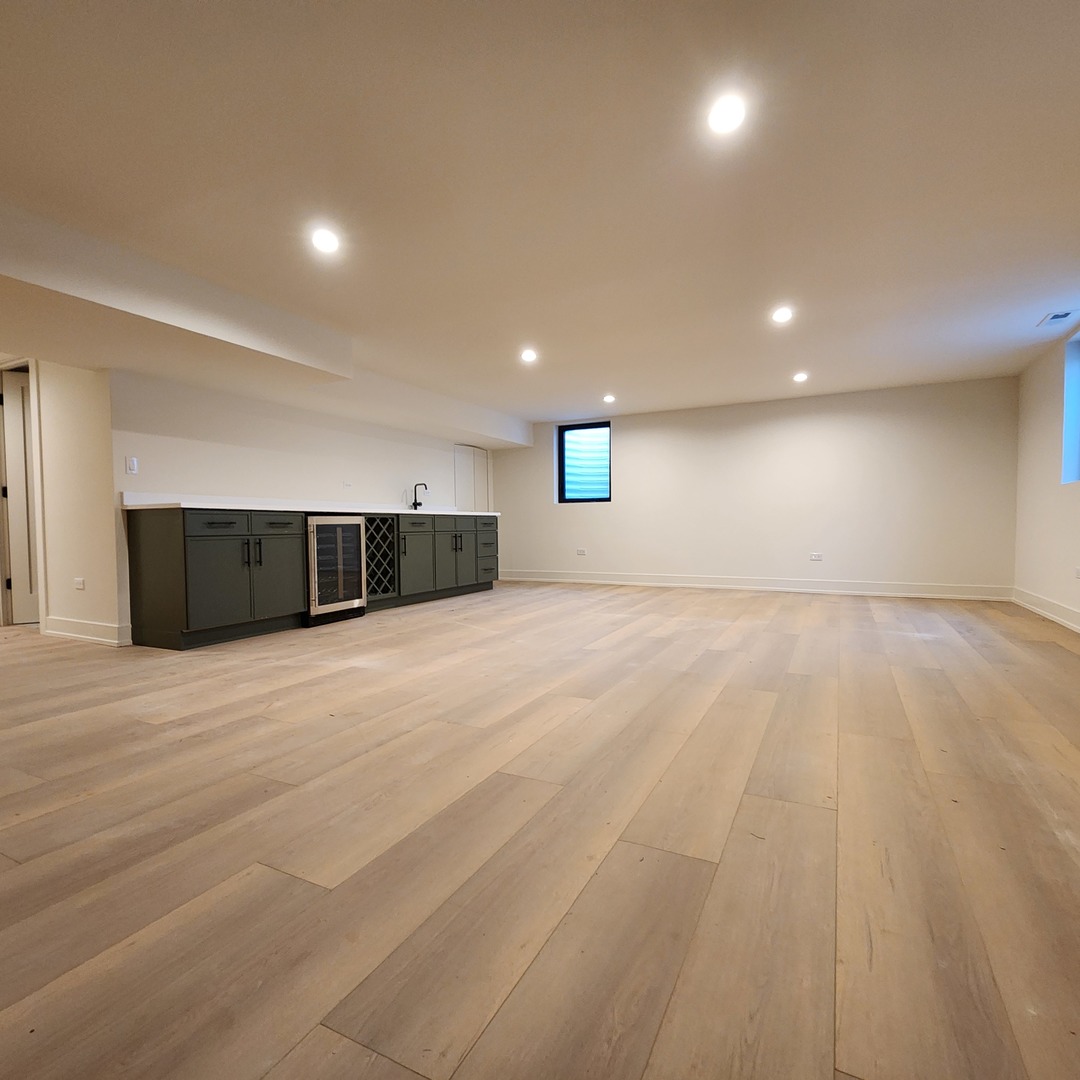 1975 Sunset Ridge Road Northfield, IL 60093 - Photo 19 of 21 a view of an empty room with wooden floor and windows