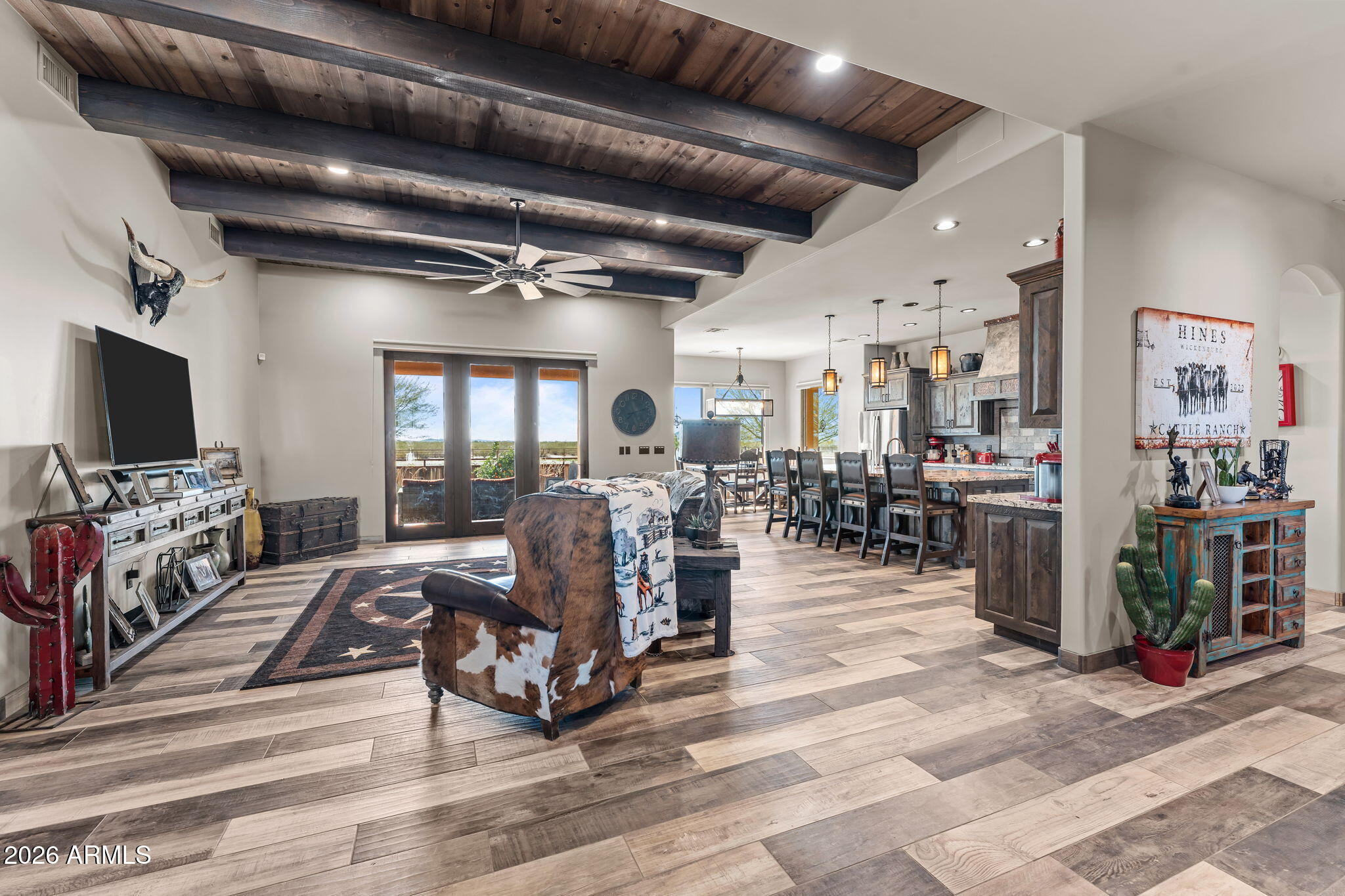 46629 West Luray Road Wickenburg, AZ 85390 - Photo 18 of 64 a living room with lots of furniture and a flat screen tv