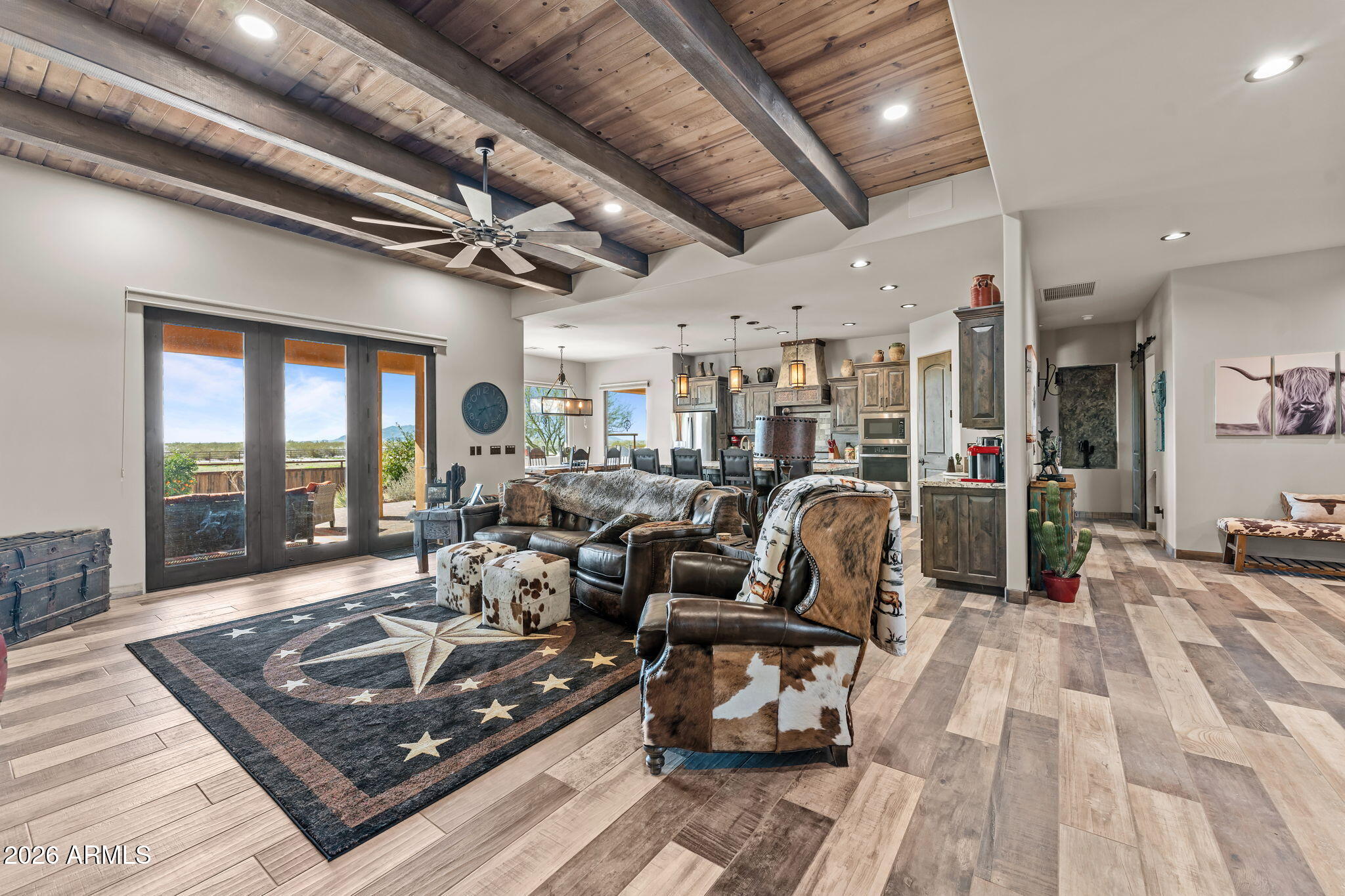 46629 West Luray Road Wickenburg, AZ 85390 - Photo 19 of 64 a living room with lots of furniture and a rug