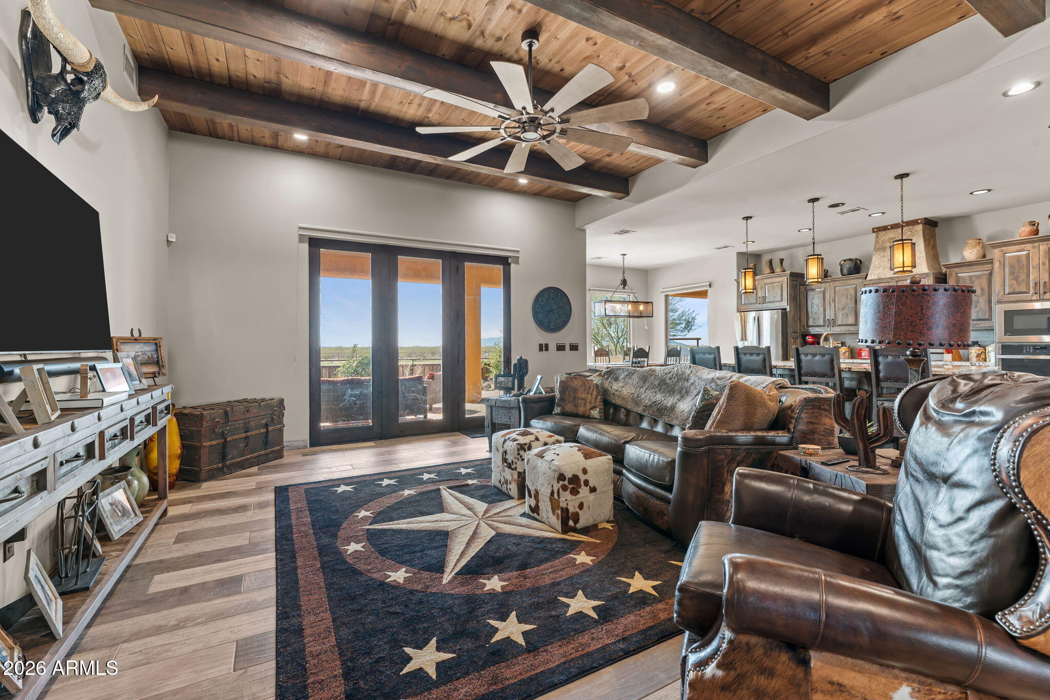 46629 West Luray Road Wickenburg, AZ 85390 - Photo 20 of 64 a living room with furniture and a flat screen tv