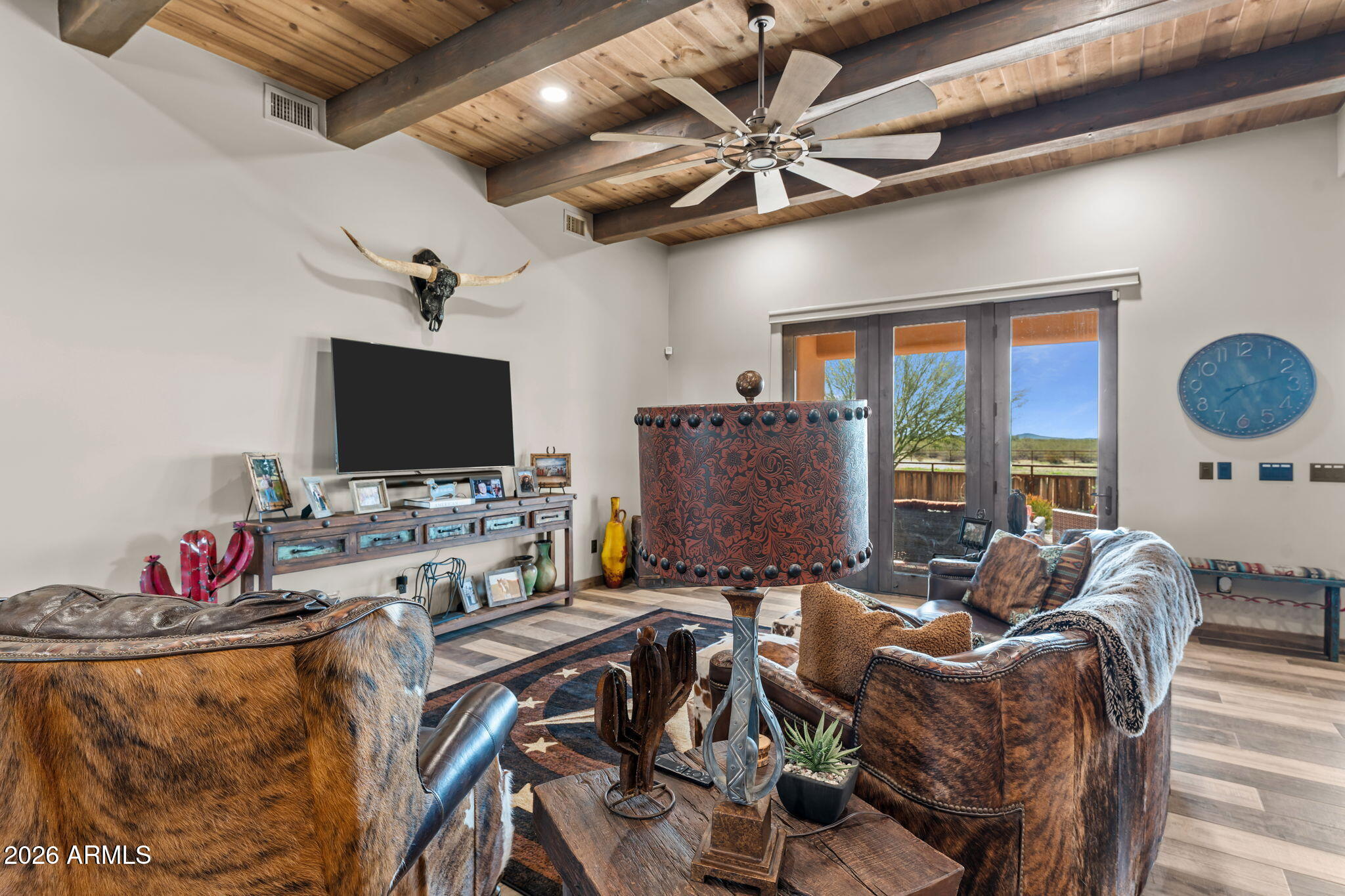 46629 West Luray Road Wickenburg, AZ 85390 - Photo 21 of 64 a living room with furniture and a flat screen tv