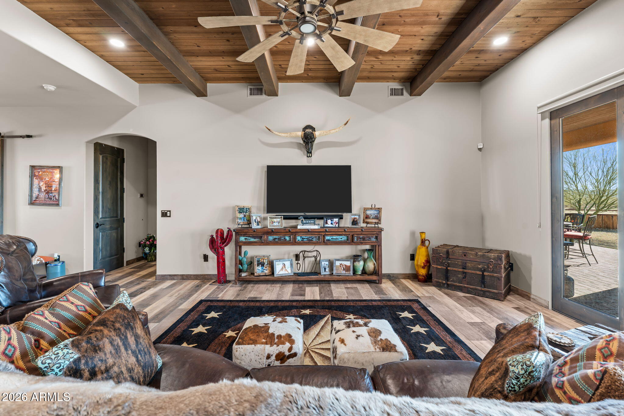46629 West Luray Road Wickenburg, AZ 85390 - Photo 22 of 64 a living room with furniture and a flat screen tv