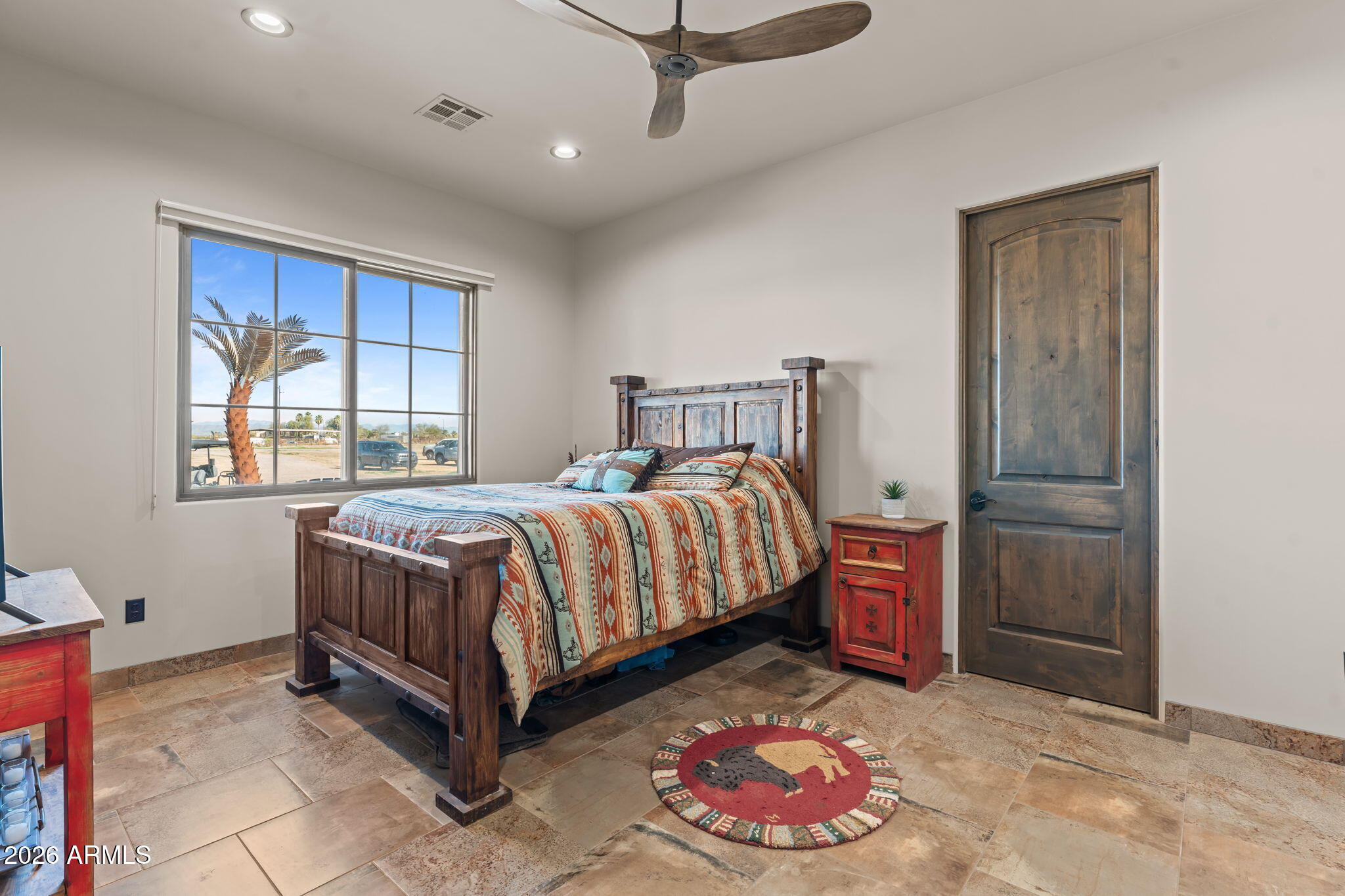 46629 West Luray Road Wickenburg, AZ 85390 - Photo 30 of 64 a bedroom with a bed and a window