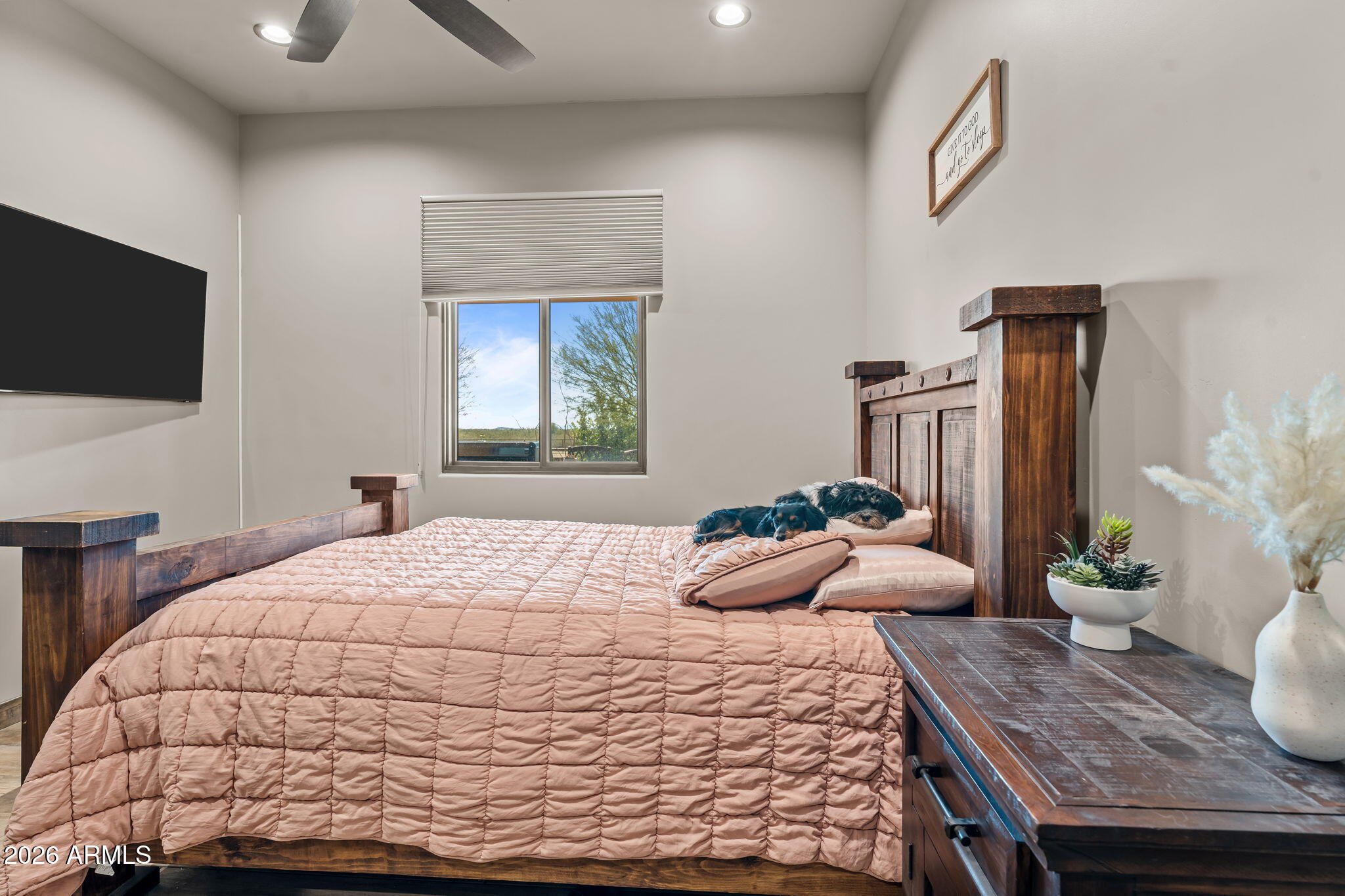 46629 West Luray Road Wickenburg, AZ 85390 - Photo 35 of 64 a bedroom with a bed and a flat screen tv