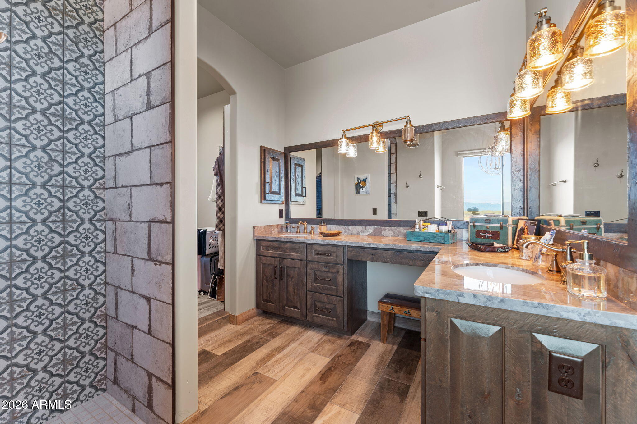 46629 West Luray Road Wickenburg, AZ 85390 - Photo 41 of 64 a bathroom with a granite countertop sink and a mirror