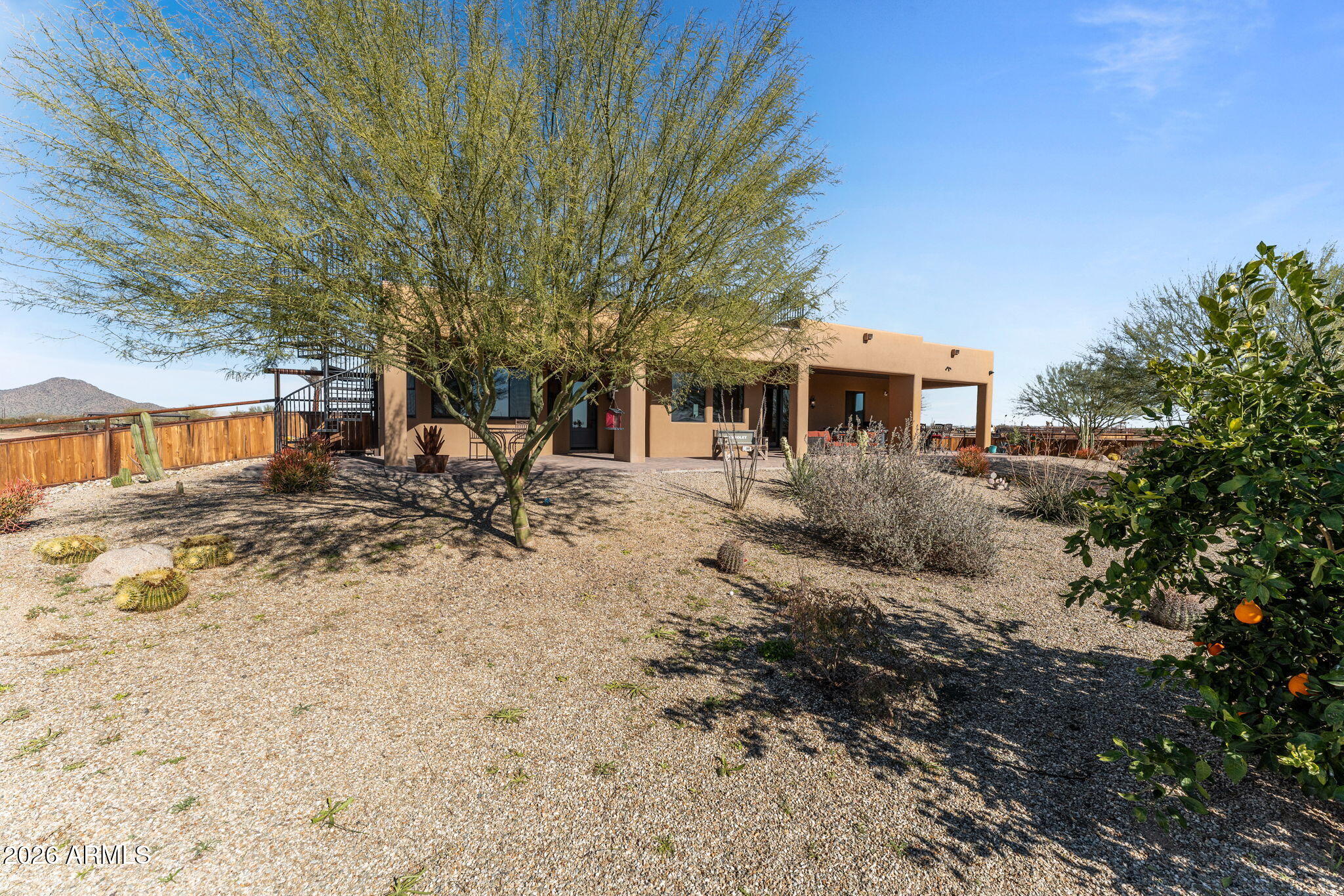 46629 West Luray Road Wickenburg, AZ 85390 - Photo 48 of 64 a front view of a house with a yard