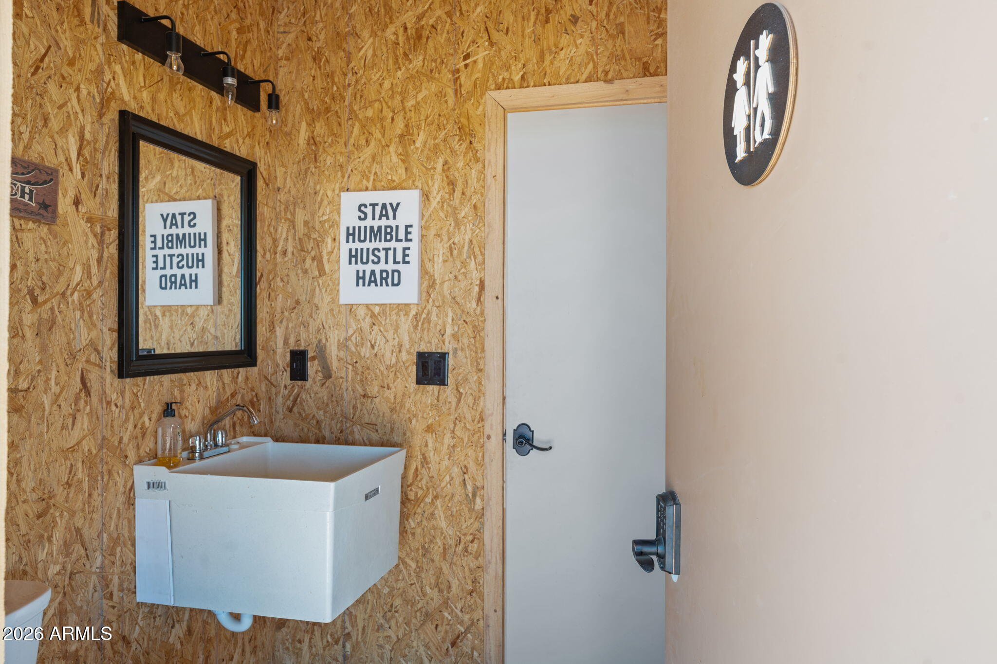 46629 West Luray Road Wickenburg, AZ 85390 - Photo 56 of 64 a bathroom with a tub sink and mirror