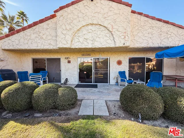 a living room with a bed and furniture