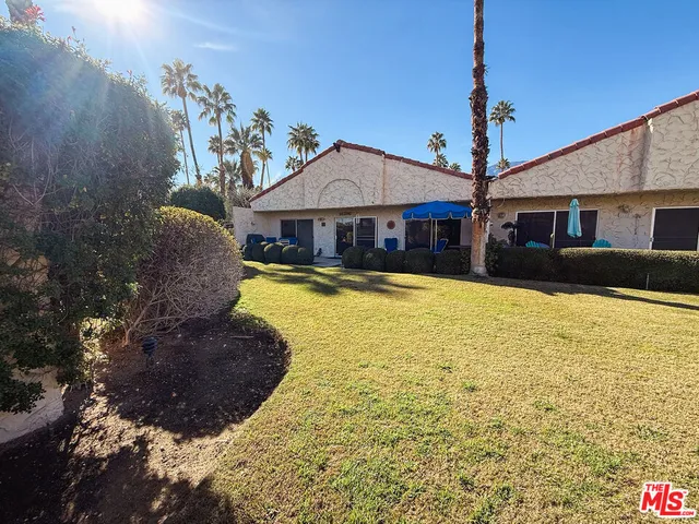 a view of a house with swimming pool yard and furniture