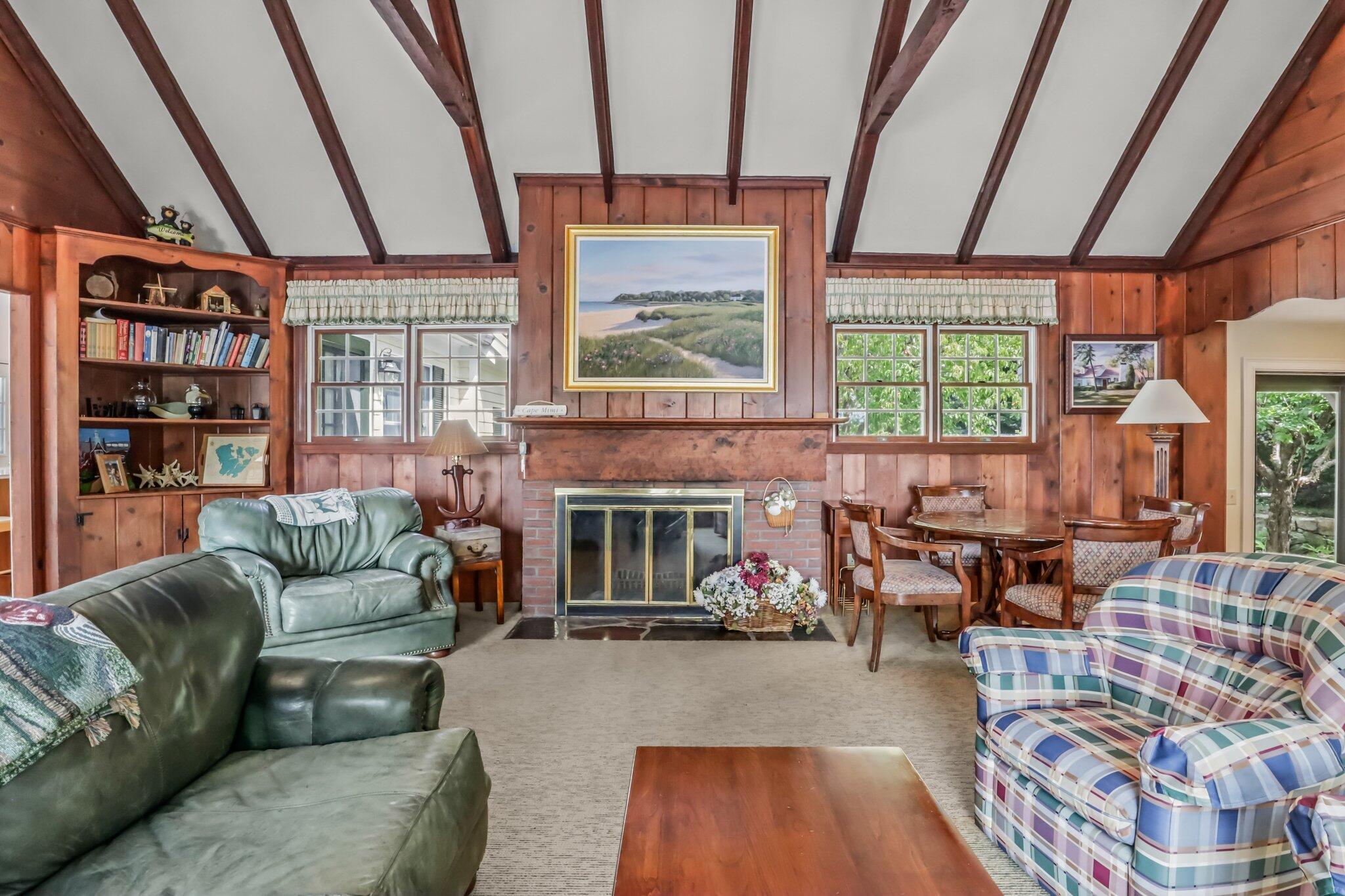 435 Huckins Neck Road Centerville, MA 02632 - Photo 13 of 42 a living room with furniture and a large window