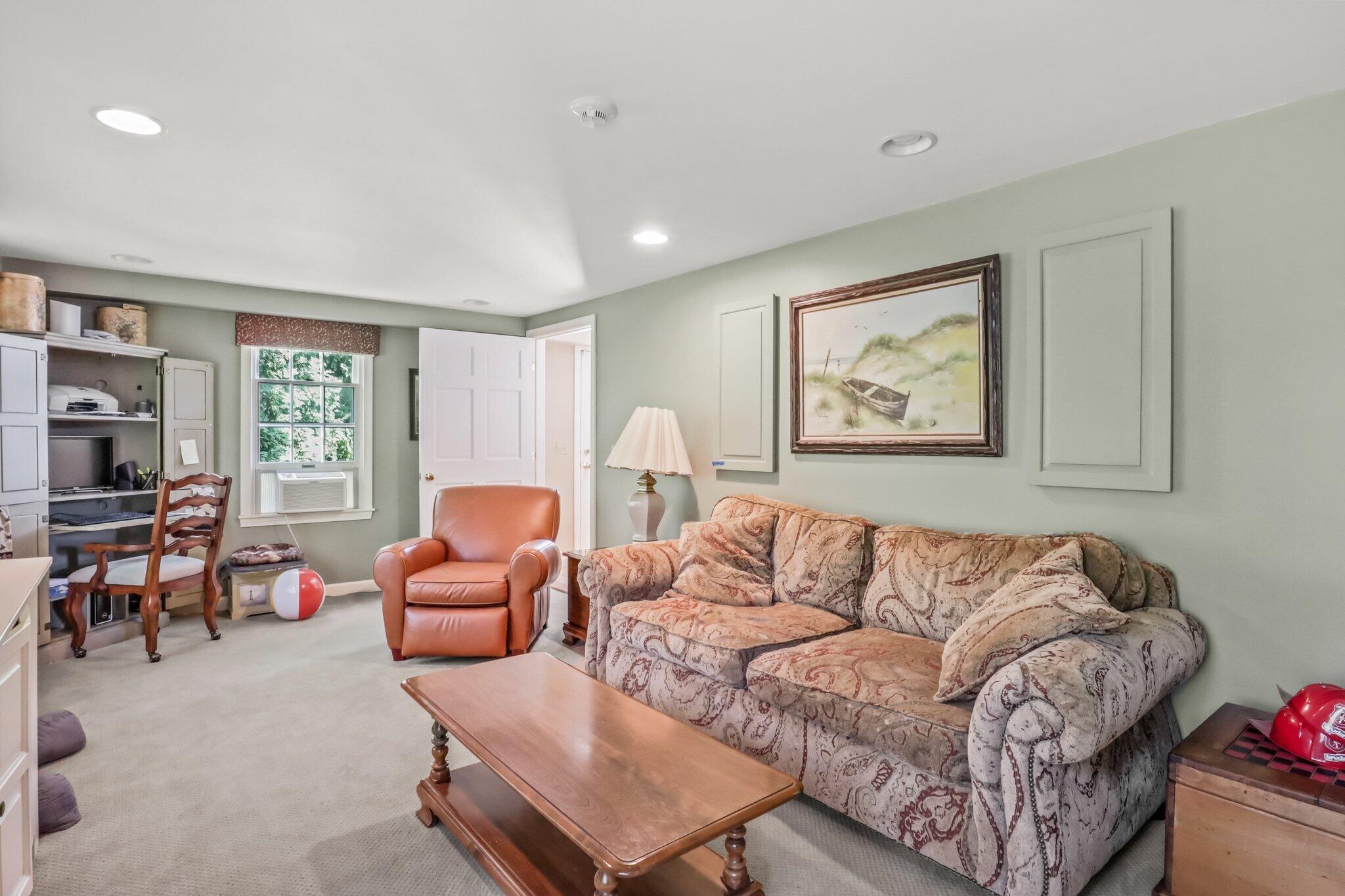 435 Huckins Neck Road Centerville, MA 02632 - Photo 22 of 42 a living room with furniture and a window