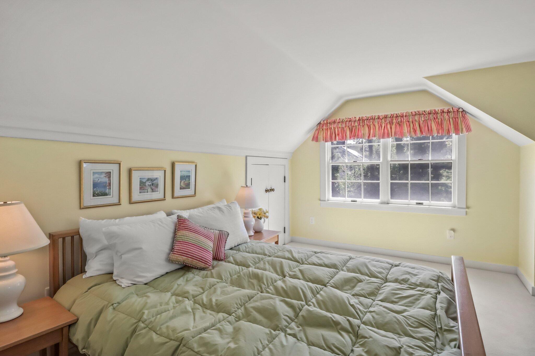 435 Huckins Neck Road Centerville, MA 02632 - Photo 25 of 42 a bedroom with a bed and a window