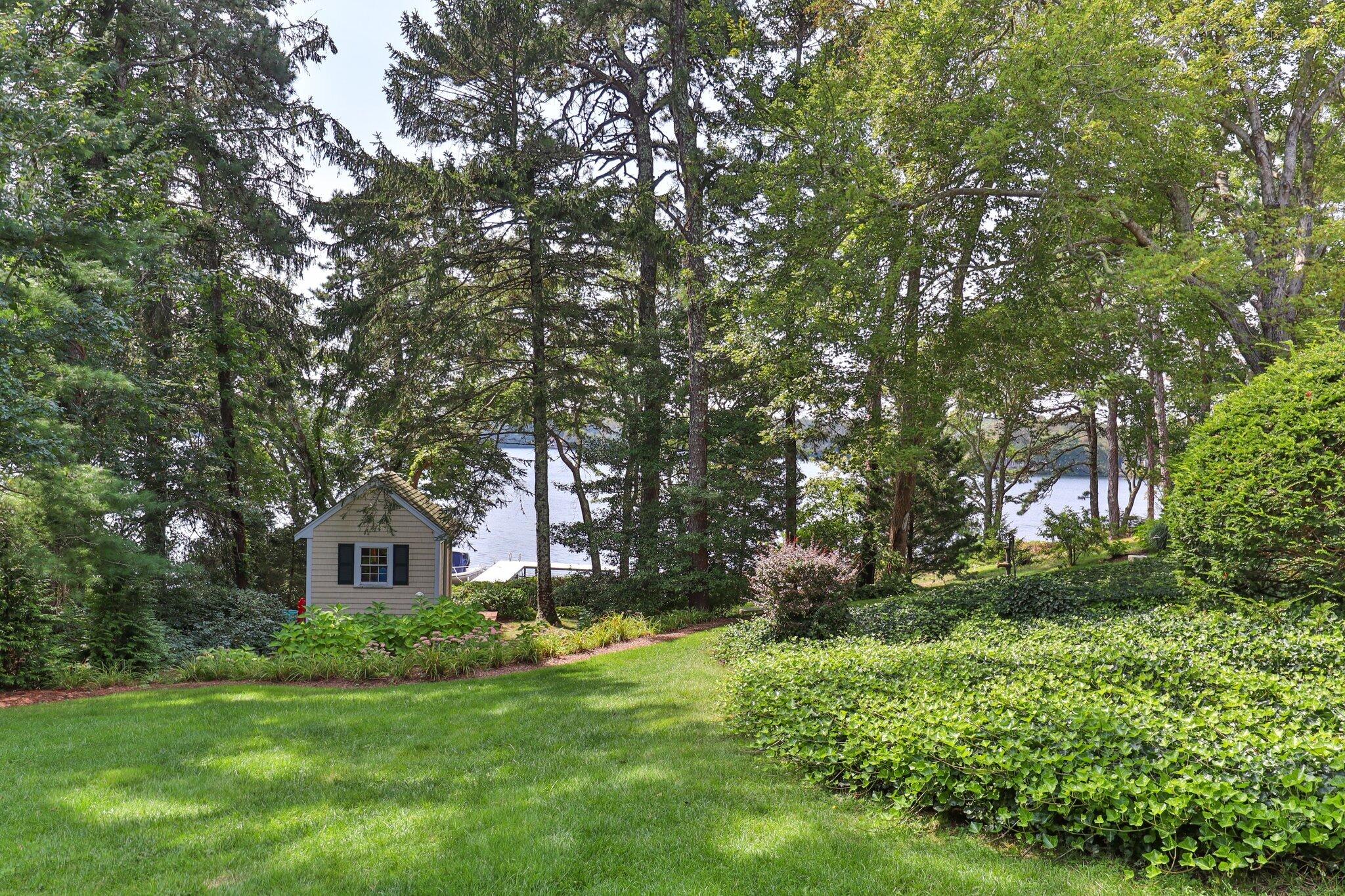 435 Huckins Neck Road Centerville, MA 02632 - Photo 28 of 42 a front view of a house with garden
