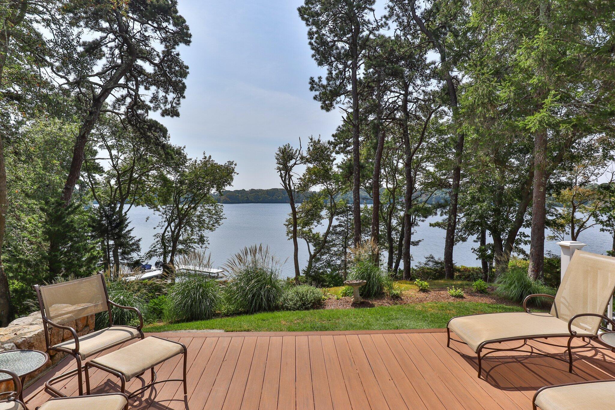 435 Huckins Neck Road Centerville, MA 02632 - Photo 33 of 42 a view of a patio with couches table and chairs and garden