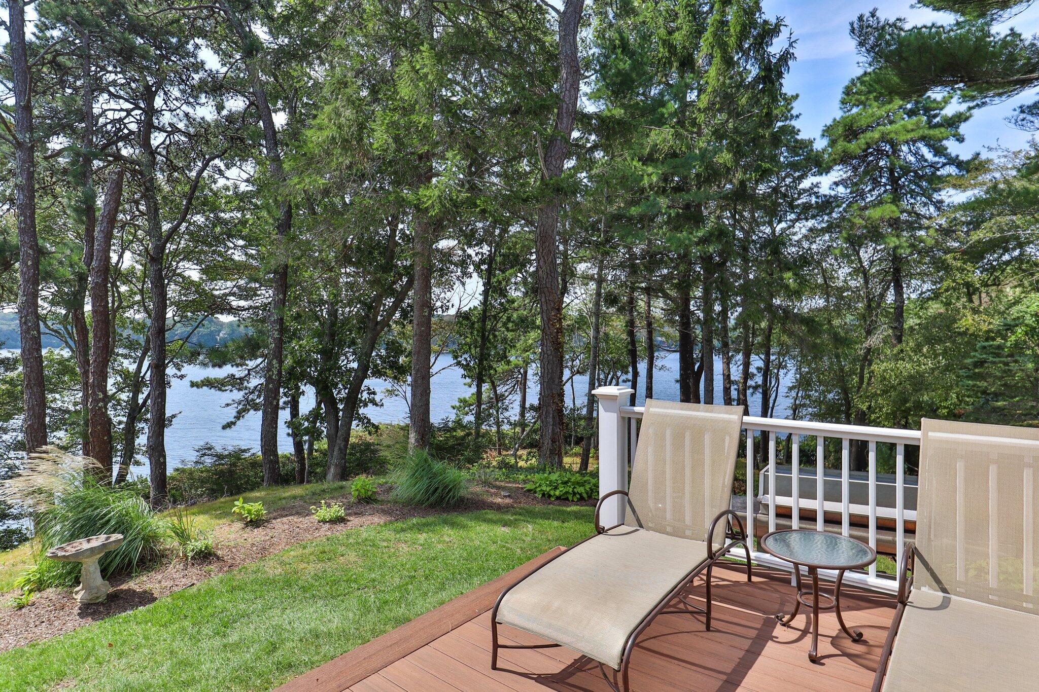 435 Huckins Neck Road Centerville, MA 02632 - Photo 37 of 42 a view of a chair and fire pit in the backyard