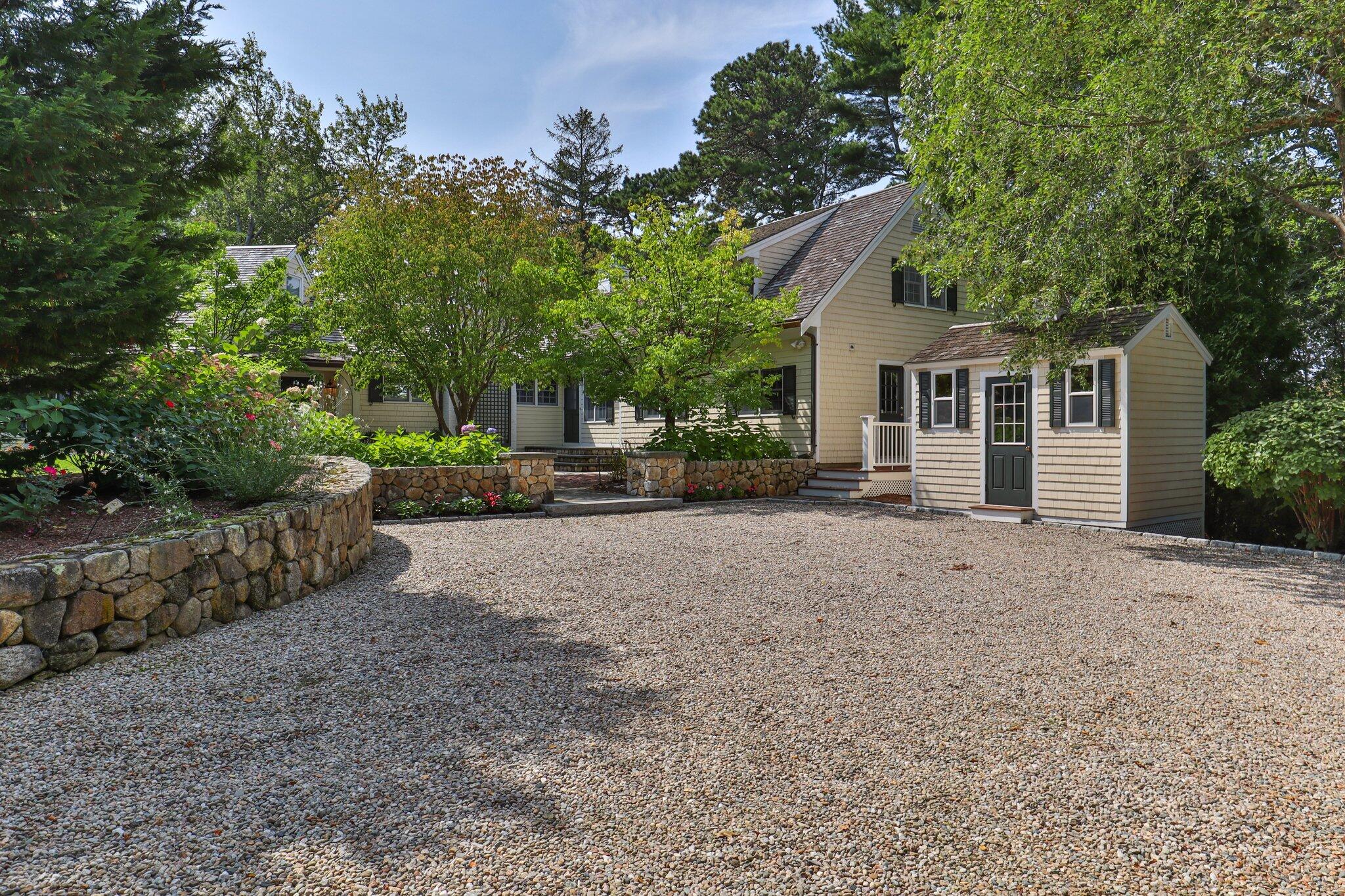 435 Huckins Neck Road Centerville, MA 02632 - Photo 4 of 42 a view of a house with a backyard and tree
