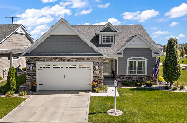a front view of a house with a yard