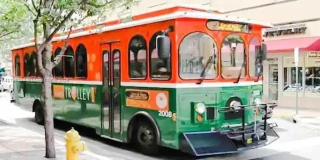 a front view of building with retail shops