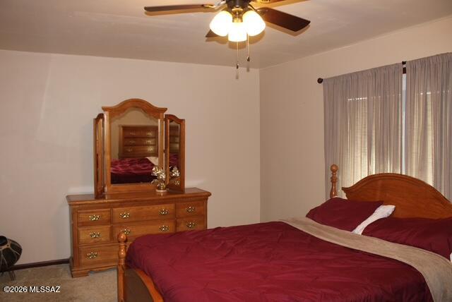 1201 East Old Stewart Road Willcox, AZ 85643 - Photo 35 of 49 a bedroom with a bed and a dresser