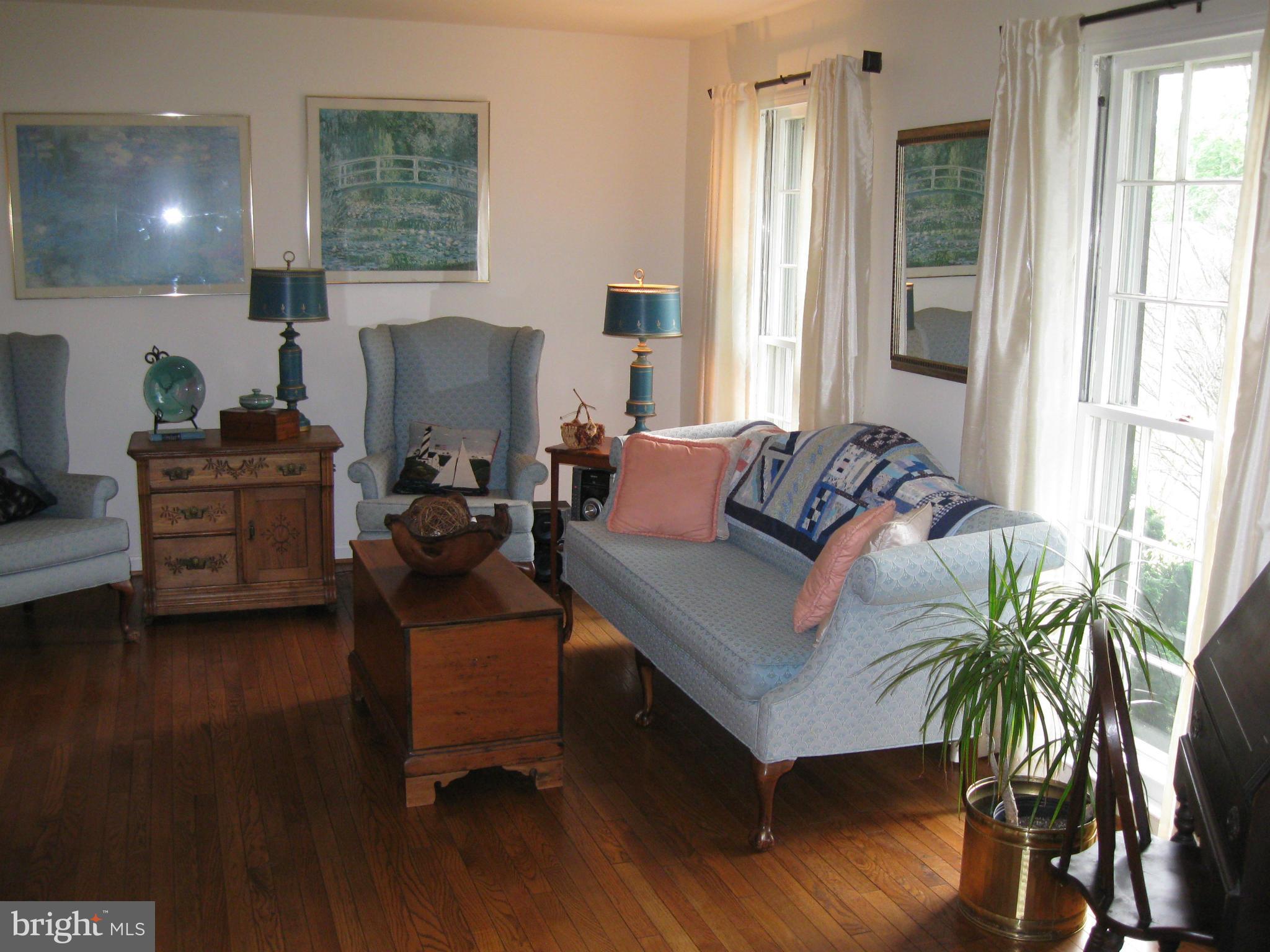 1700 Chester Mill Road Silver Spring, MD 20906 - Photo 5 of 30 Hardwood floors in the bright living room