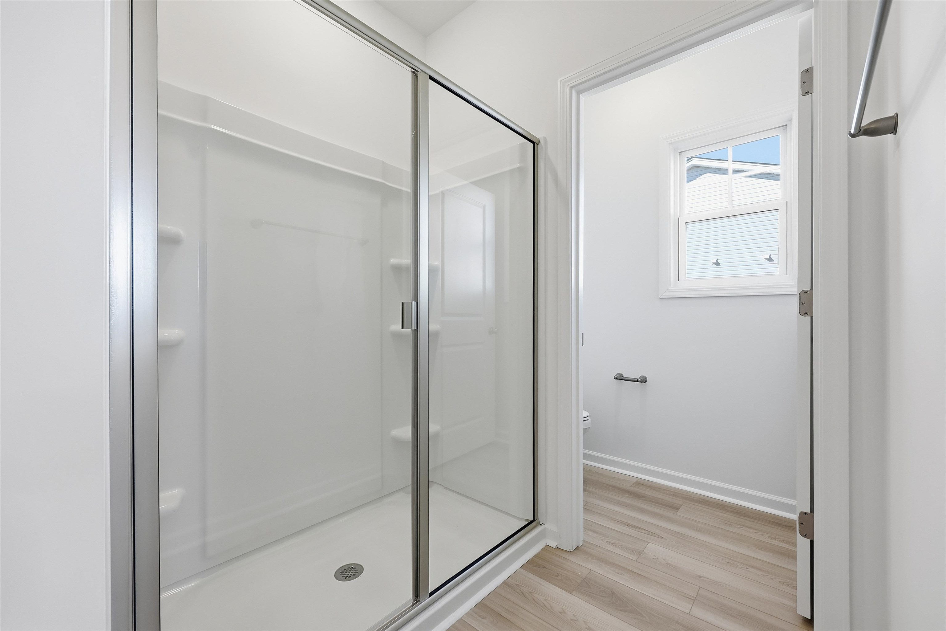 142 River Birch Drive Loris, SC 29569 - Photo 17 of 39 Bathroom featuring a stall shower and light wood-style flooring