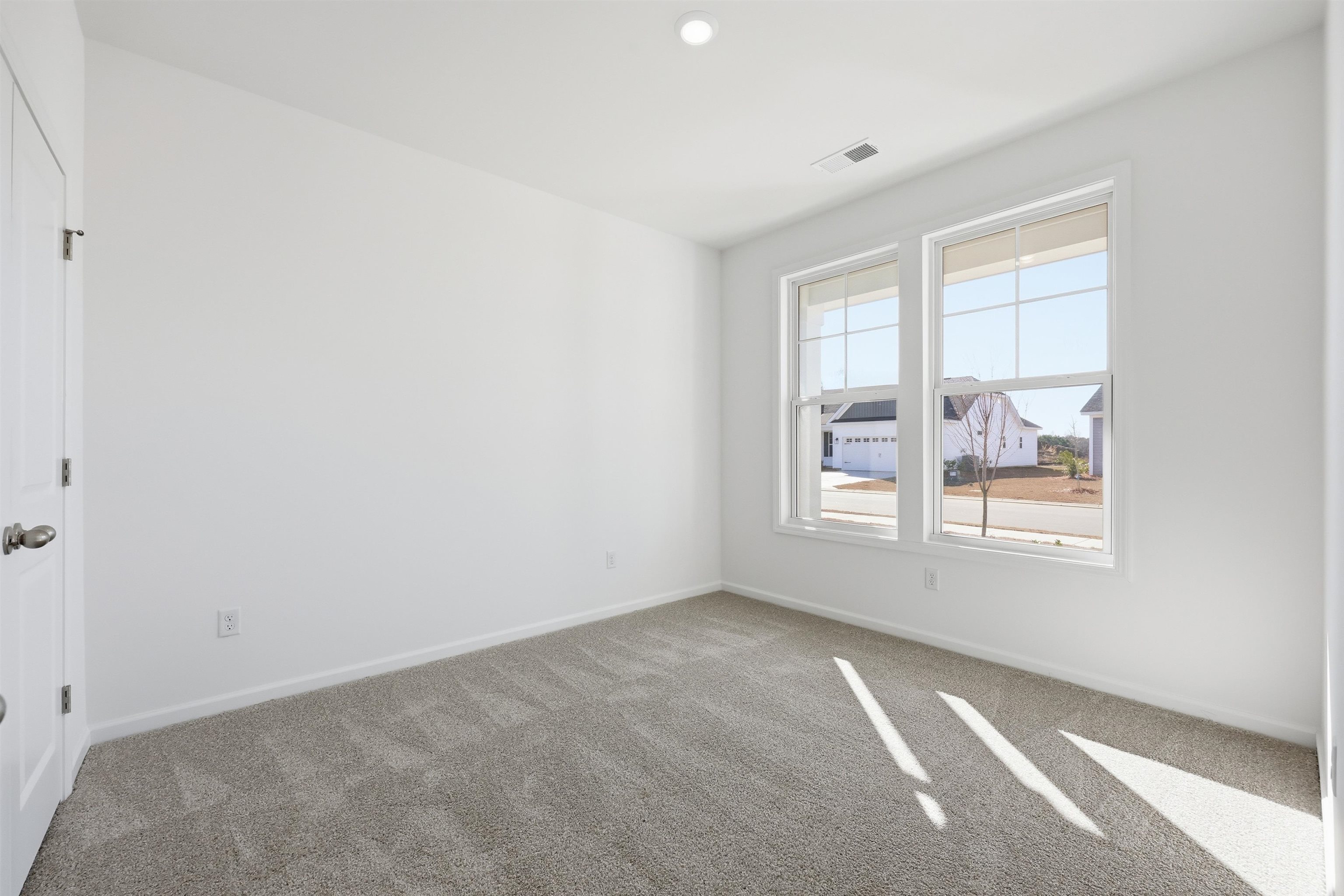 142 River Birch Drive Loris, SC 29569 - Photo 25 of 39 Empty room featuring carpet floors and baseboards