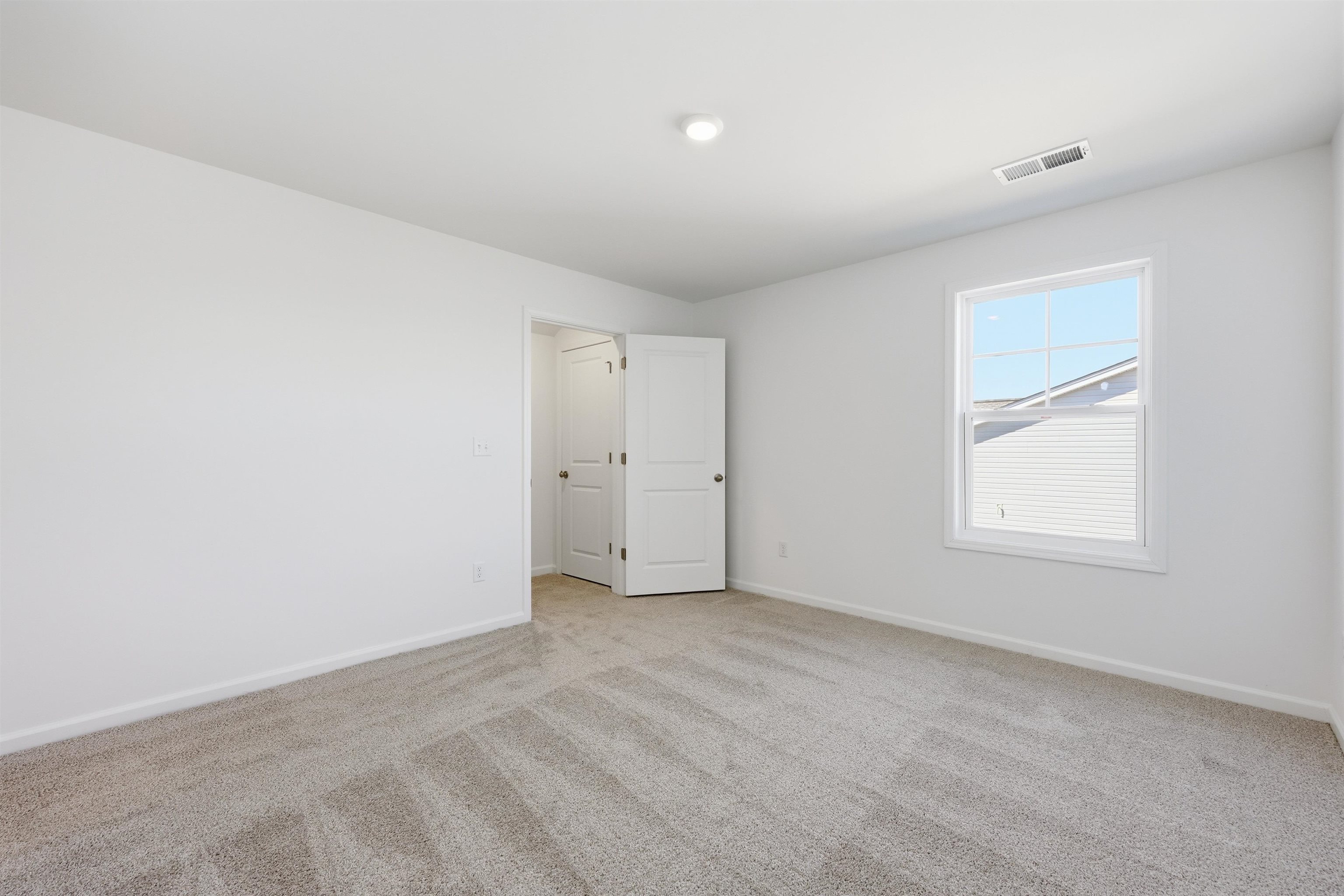 142 River Birch Drive Loris, SC 29569 - Photo 27 of 39 Empty room featuring light carpet and baseboards