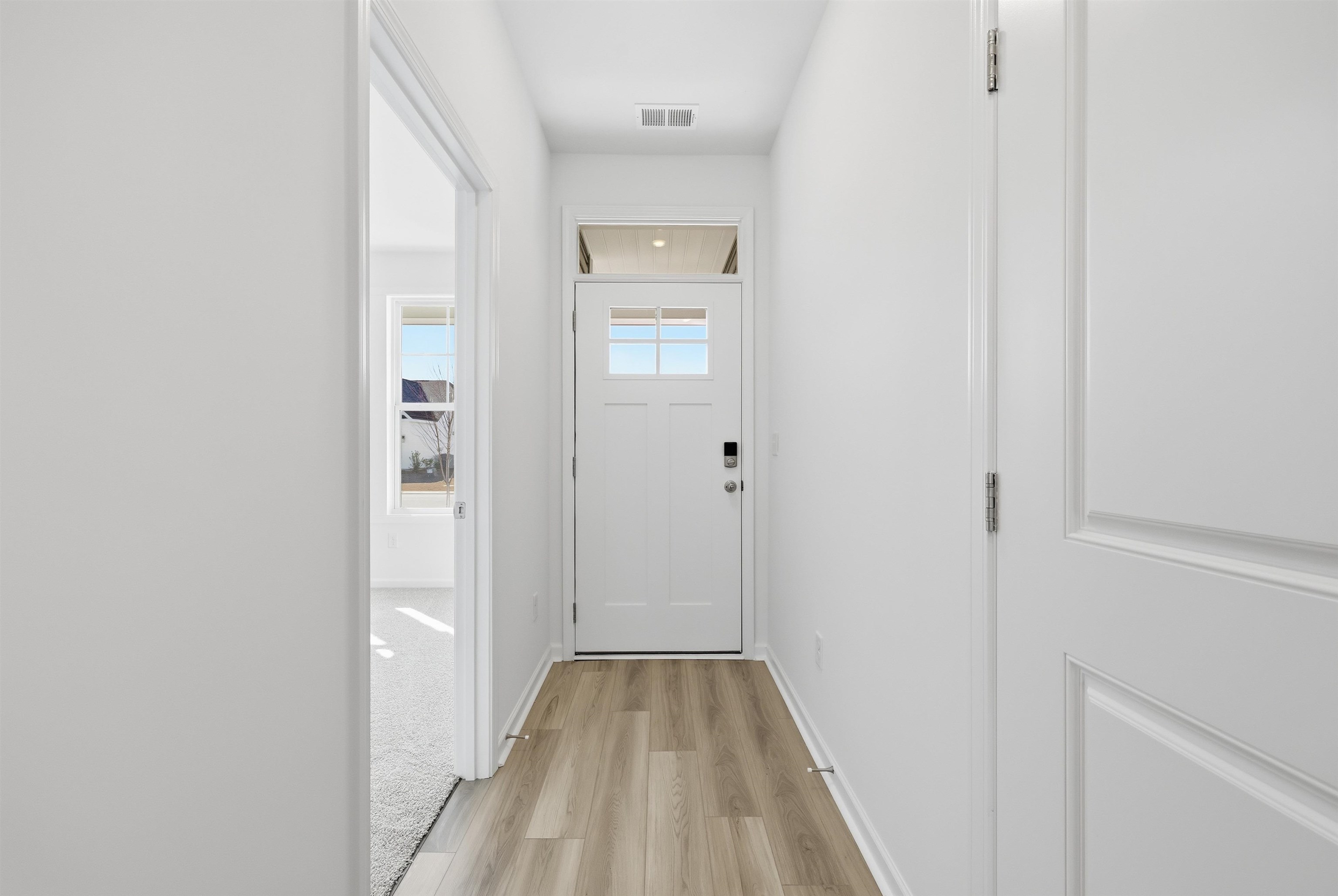 142 River Birch Drive Loris, SC 29569 - Photo 3 of 39 Doorway with wood finished floors and baseboards
