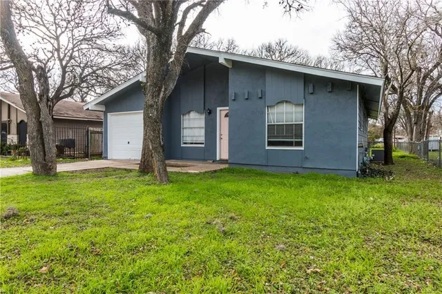 a backyard of a house with lots of green space
