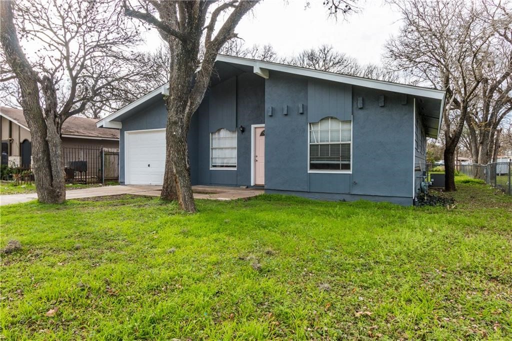 6005 Hogan Avenue Austin, TX 78741 - Photo 12 of 19 a backyard of a house with lots of green space