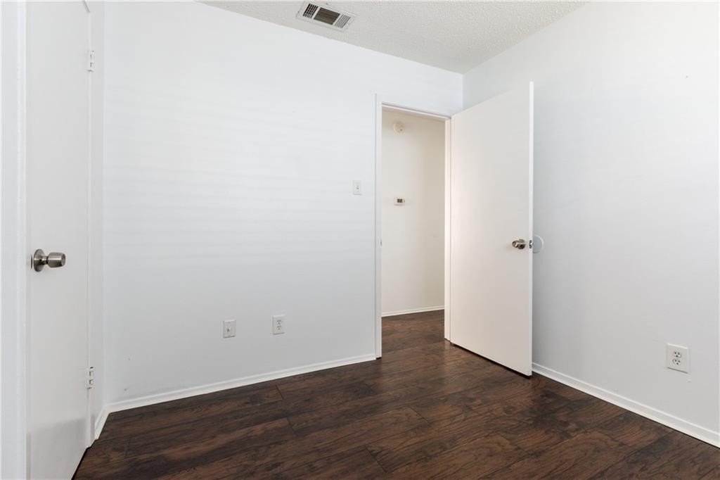 6005 Hogan Avenue Austin, TX 78741 - Photo 14 of 19 an empty room with wooden floor
