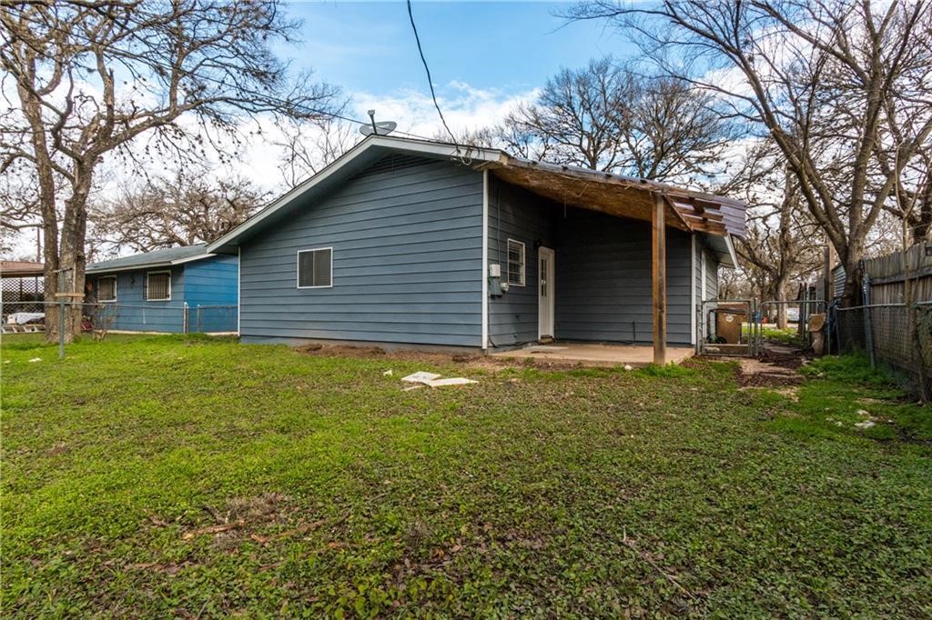 6005 Hogan Avenue Austin, TX 78741 - Photo 19 of 19 a house is sitting in middle of the forest