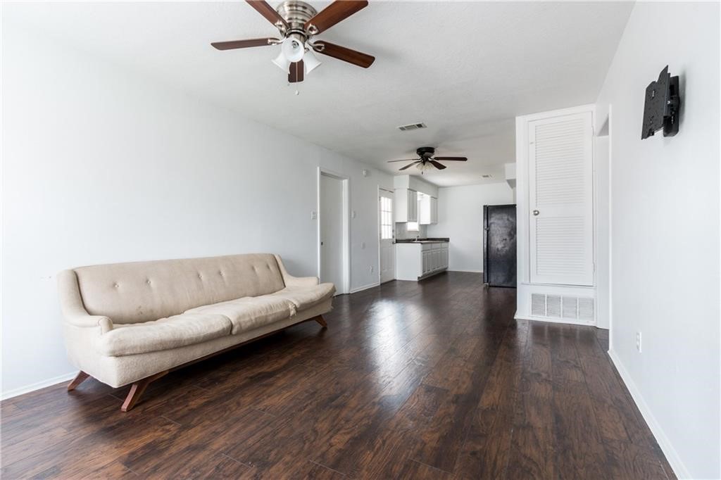 6005 Hogan Avenue Austin, TX 78741 - Photo 10 of 19 a living room with furniture and a wooden floor