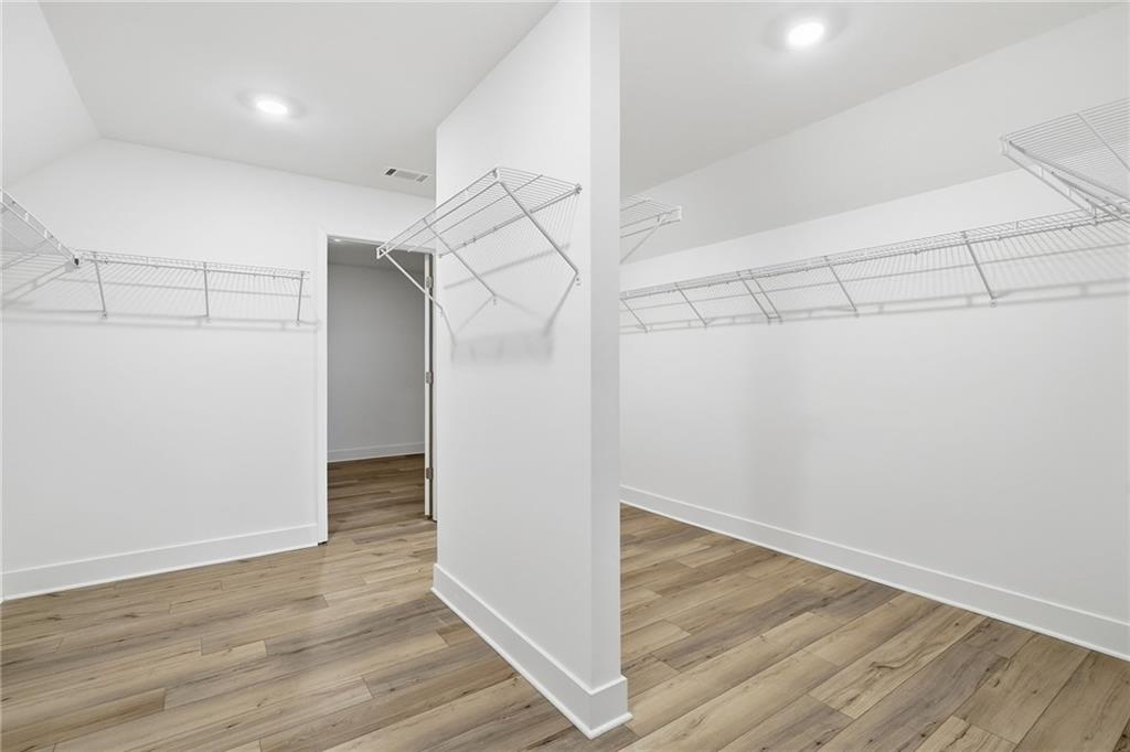 259 Deer Valley Run Canton, GA 30115 - Photo 15 of 25 a view of a hallway with wooden floor