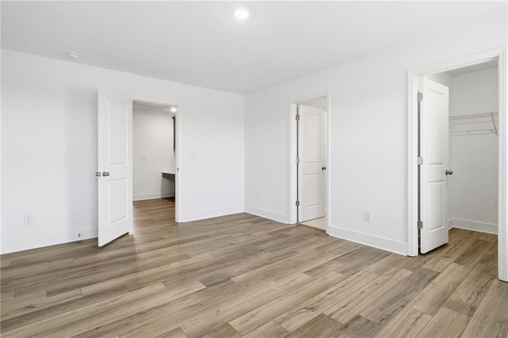 259 Deer Valley Run Canton, GA 30115 - Photo 17 of 25 a view of an empty room with wooden floor