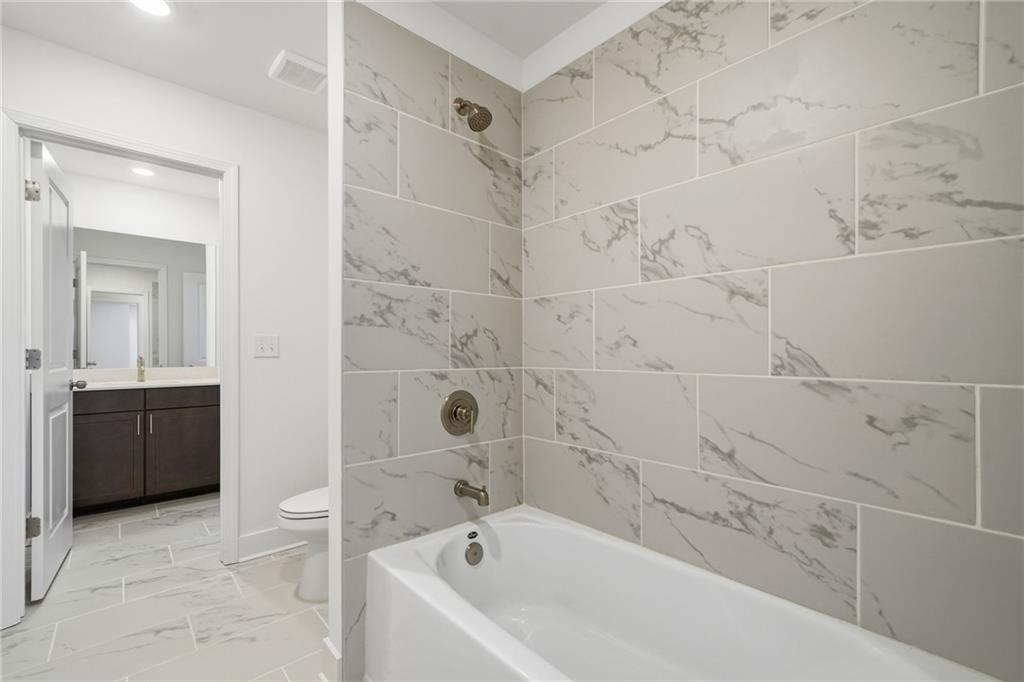 259 Deer Valley Run Canton, GA 30115 - Photo 18 of 25 a bathroom with a bathtub and a sink